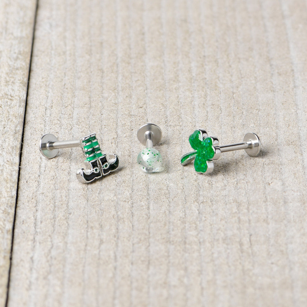 BodyCandy 16G 1/4 Leprechaun Legs Shamrock UV Glow Labret Set of 3 — in-use photo