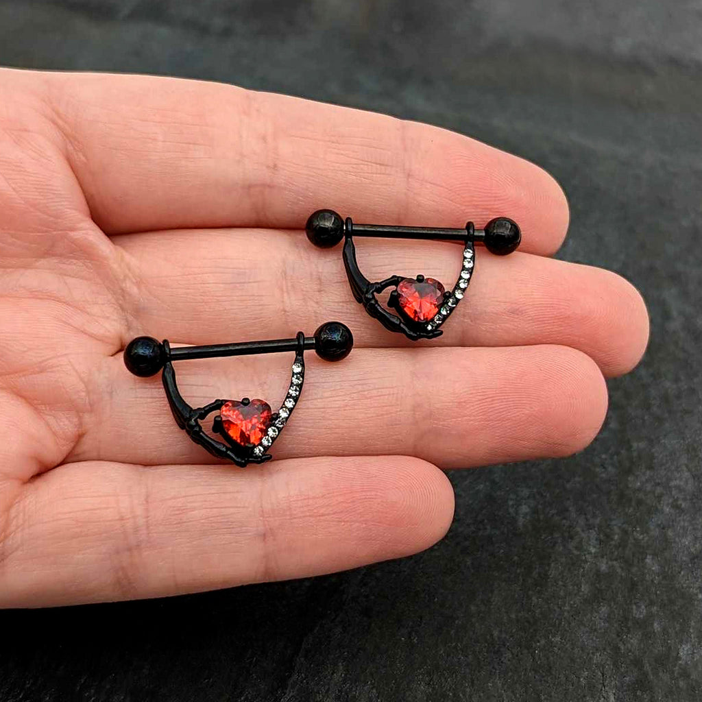 BodyCandy 14G 11/16 Red Clear CZ Gem Heart Claw Hand Dangle Nipple Ring Set — in-use photo