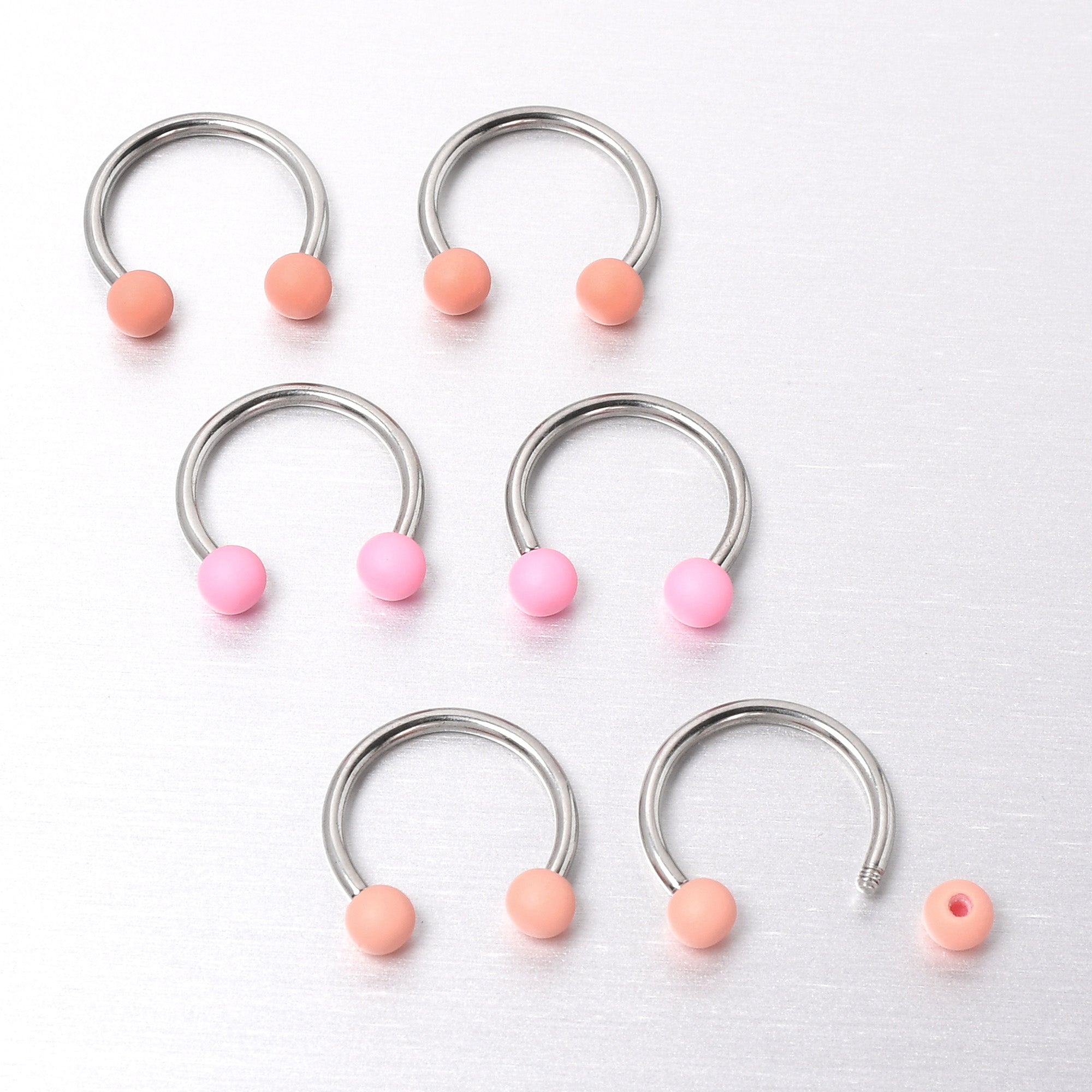 BodyCandy 16G 3/8 Matte Pinks Peach Horseshoe Circular Barbell Set of 6 — size reference