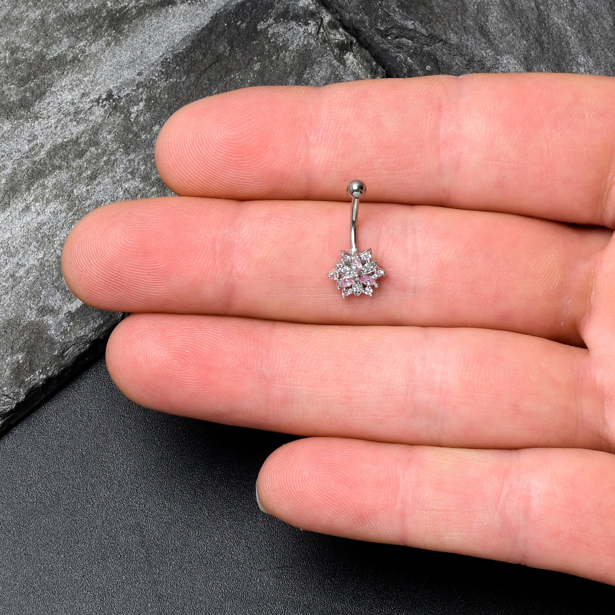 BodyCandy 16G 5/16 Pink Clear CZ Gem Snowflake Style Curved Eyebrow Ring — lifestyle context