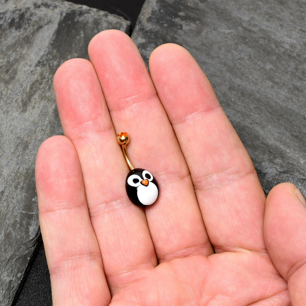 BodyCandy Red Gem Gold Tone Round Face Penguin Holiday Winter Belly Ring — in-use photo