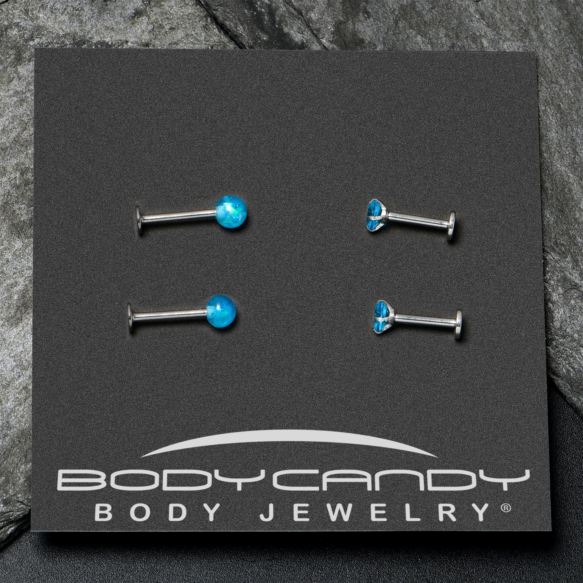 BodyCandy 16G 5/16 3/8 Blue Gem Faux Opal Labret Monroe Tragus Set of 4 — in-use photo