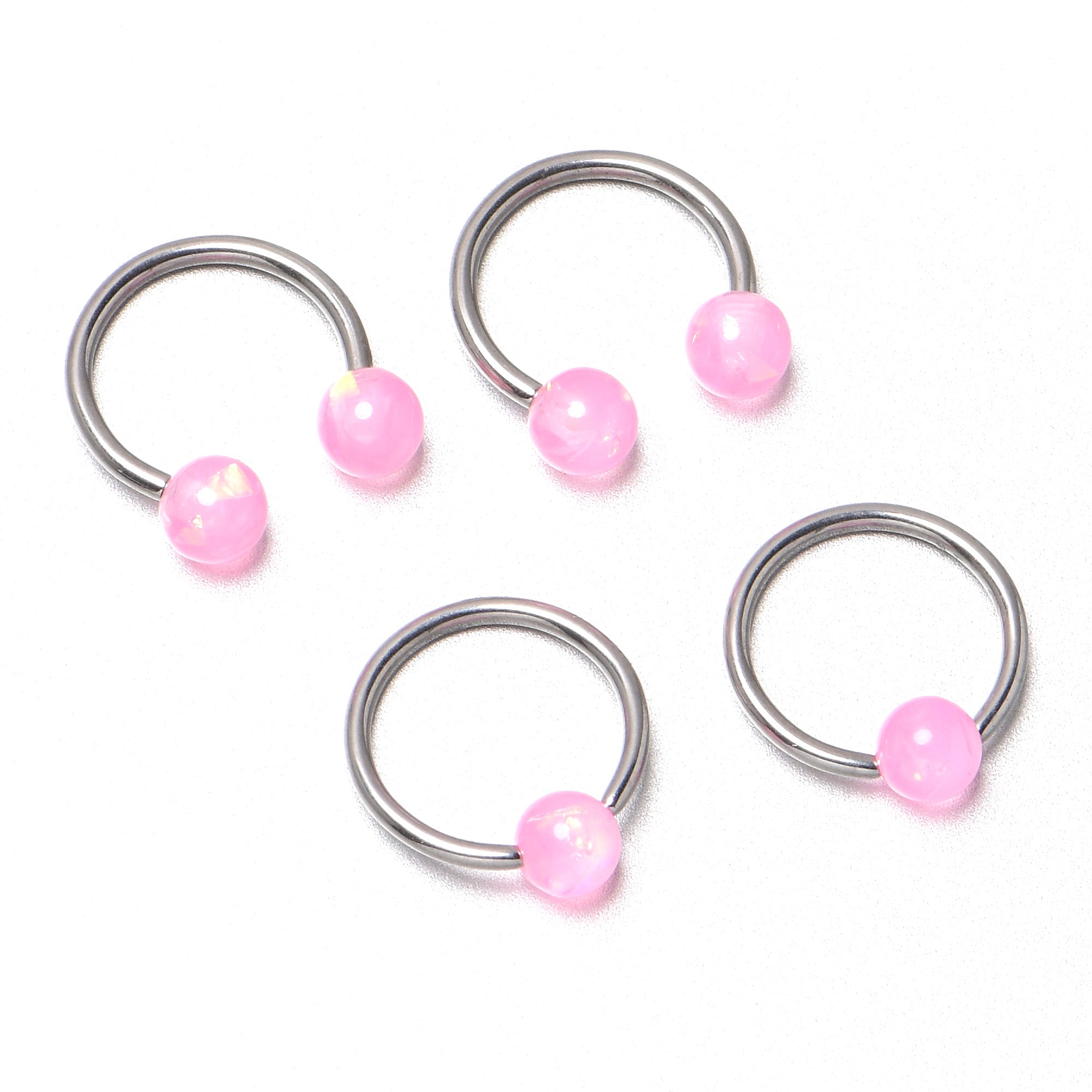 BodyCandy 16G 3/8 Pink Faux Opal Horseshoe BCR Captive Ring Set of 4 — in-use photo