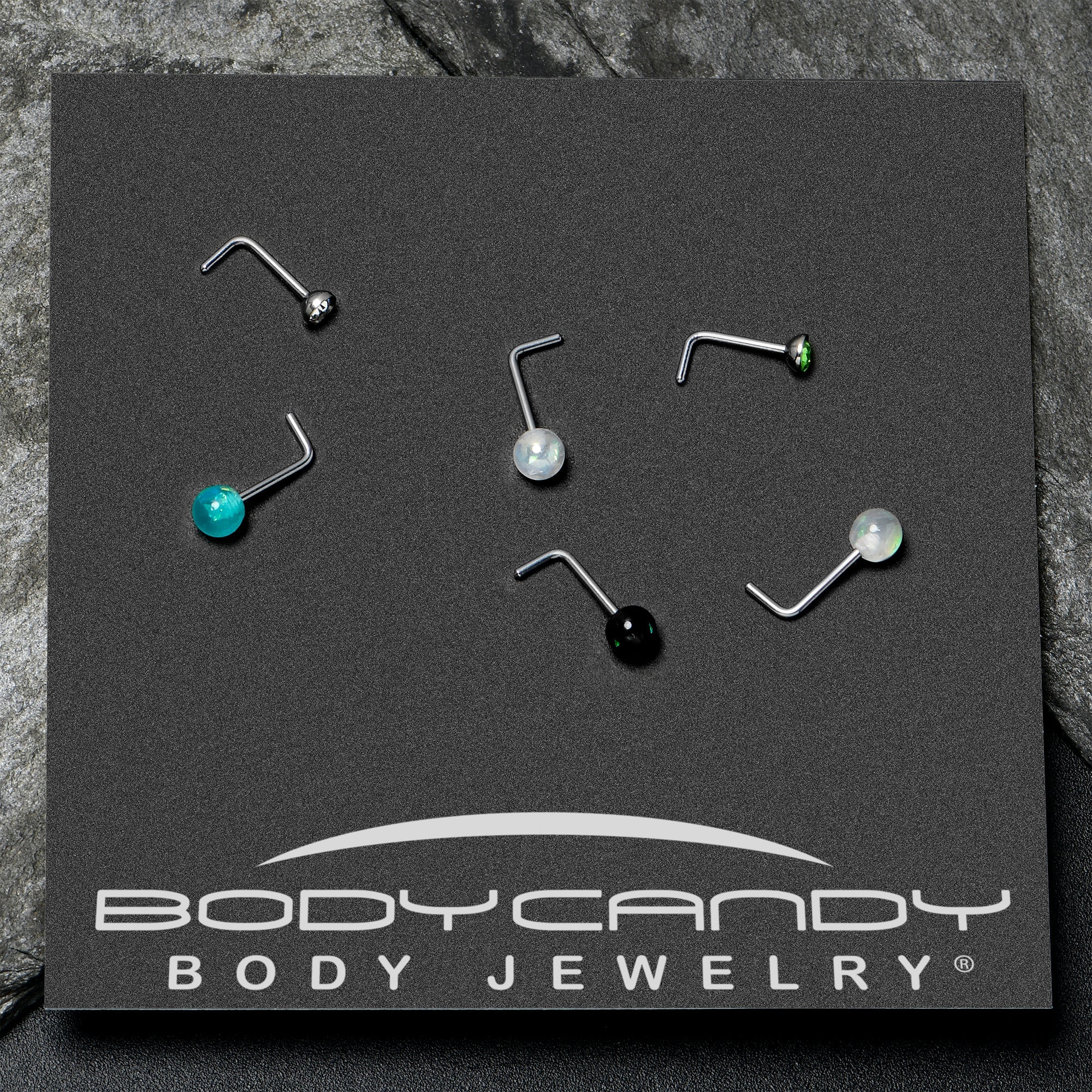 BodyCandy 20G 1/4 Green Gem Green Aurora Faux Opal Pack L Shape Nose Ring Set of 6 — in-use photo