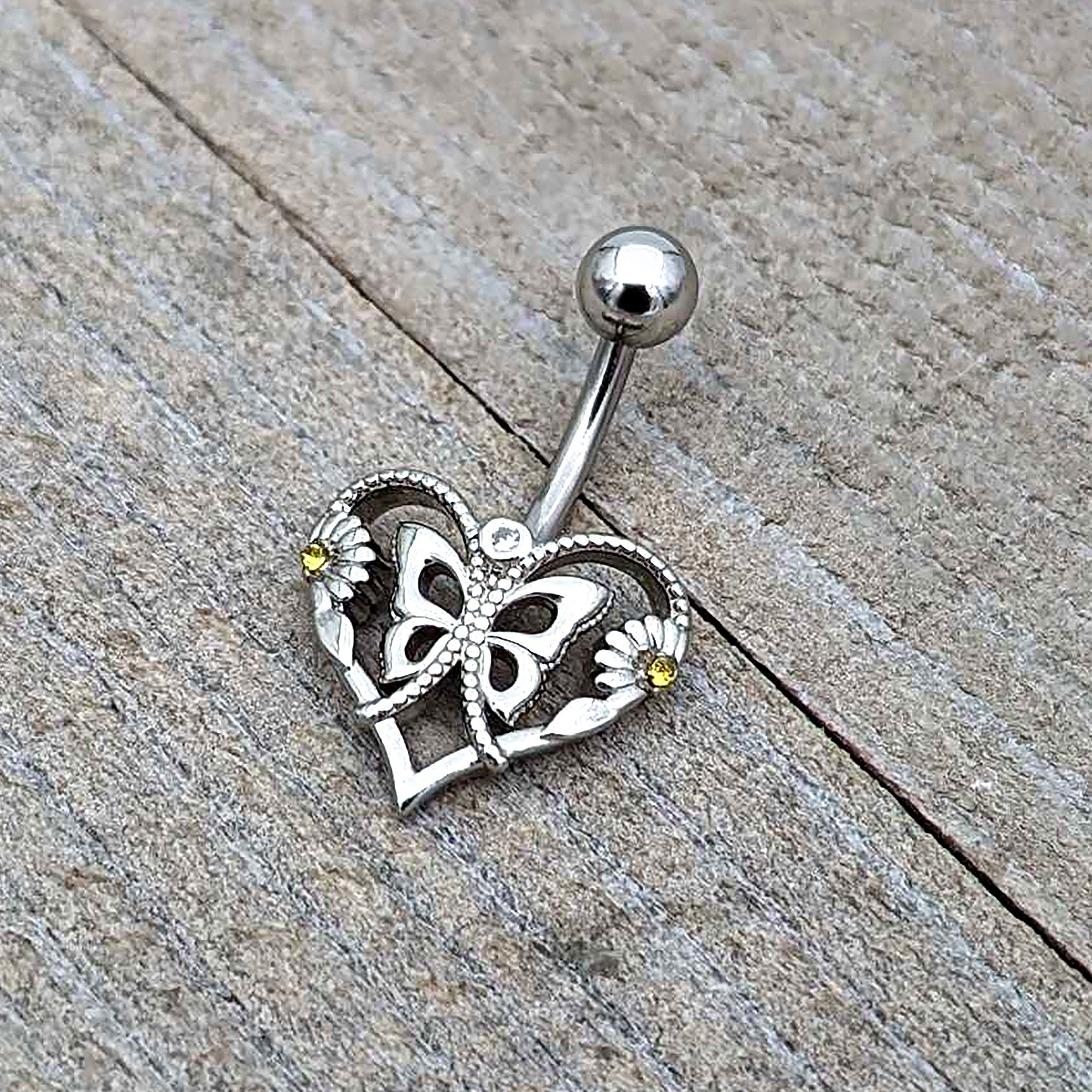 BodyCandy Clear Yellow CZ Gem Heart Flower Butterfly Belly Ring — in-use photo