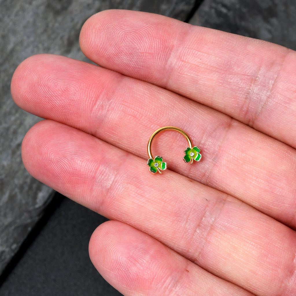 BodyCandy 16G 3/8 Clear Gem Gold Hue Lucky Shamrock Horseshoe Circular Barbell — detail close-up