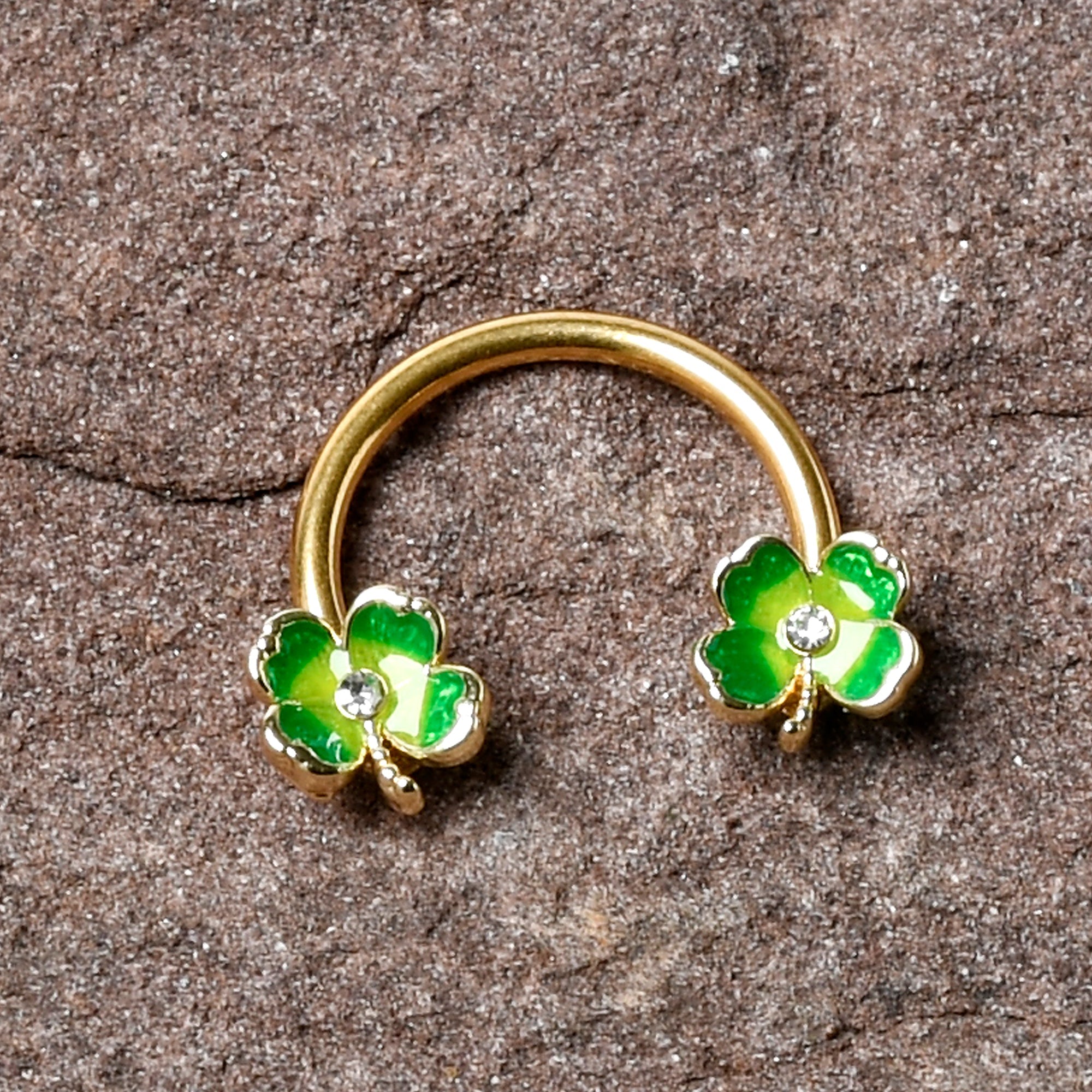 BodyCandy 16G 3/8 Clear Gem Gold Hue Lucky Shamrock Horseshoe Circular Barbell — side view