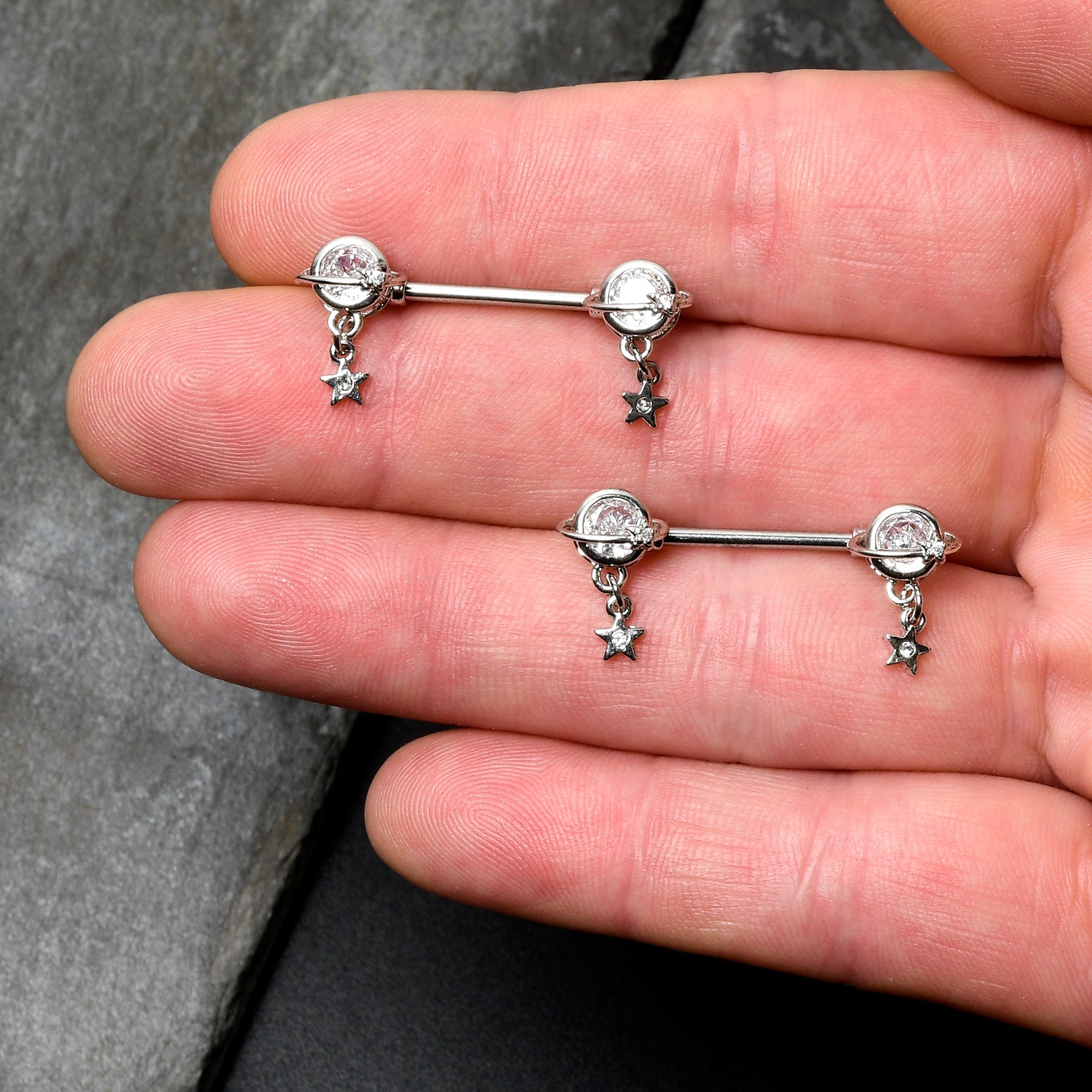 BodyCandy 14G 9/16 Clear CZ Gem Starry Saturn Dangle Nipple Ring Set — lifestyle context
