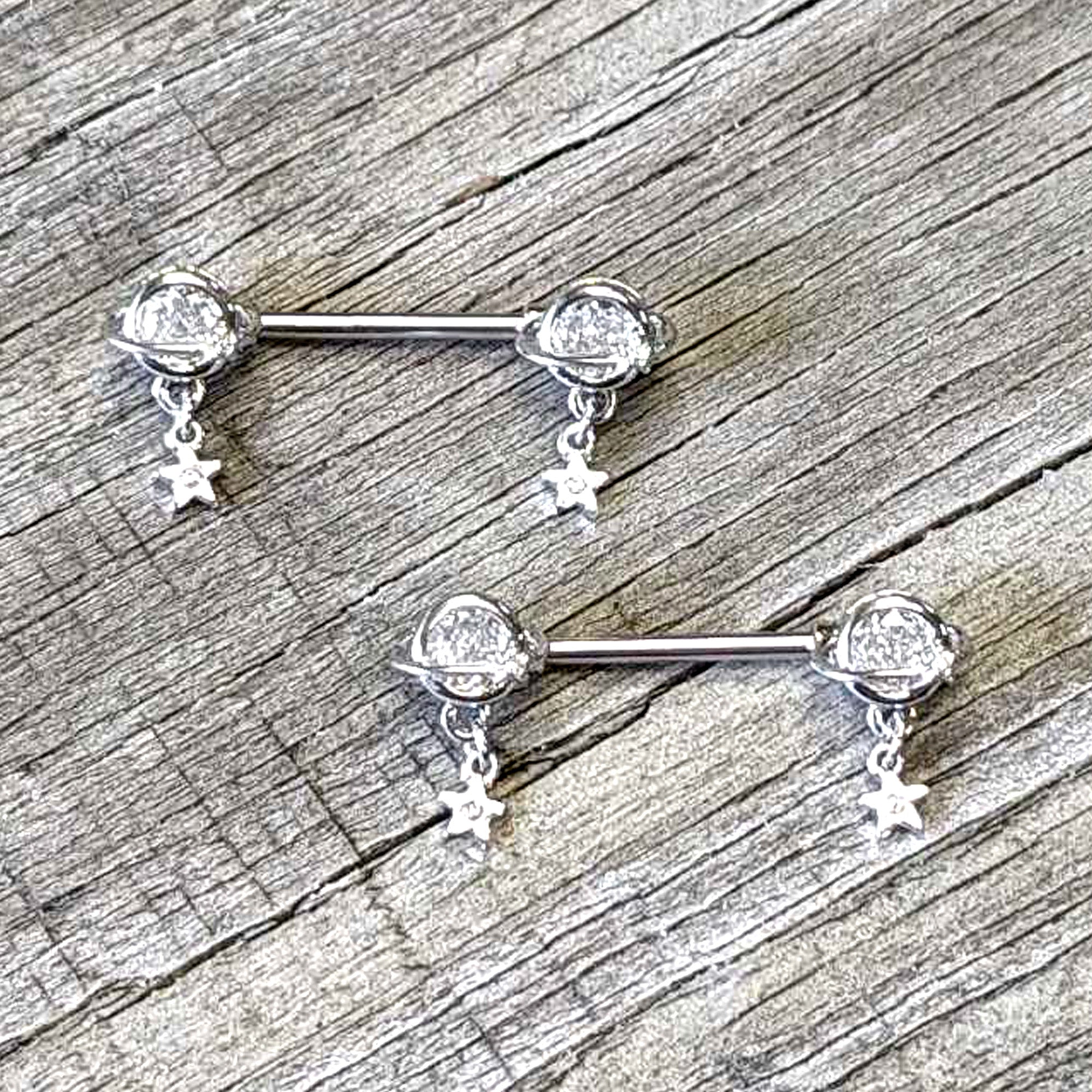 BodyCandy 14G 9/16 Clear CZ Gem Starry Saturn Dangle Nipple Ring Set — side view