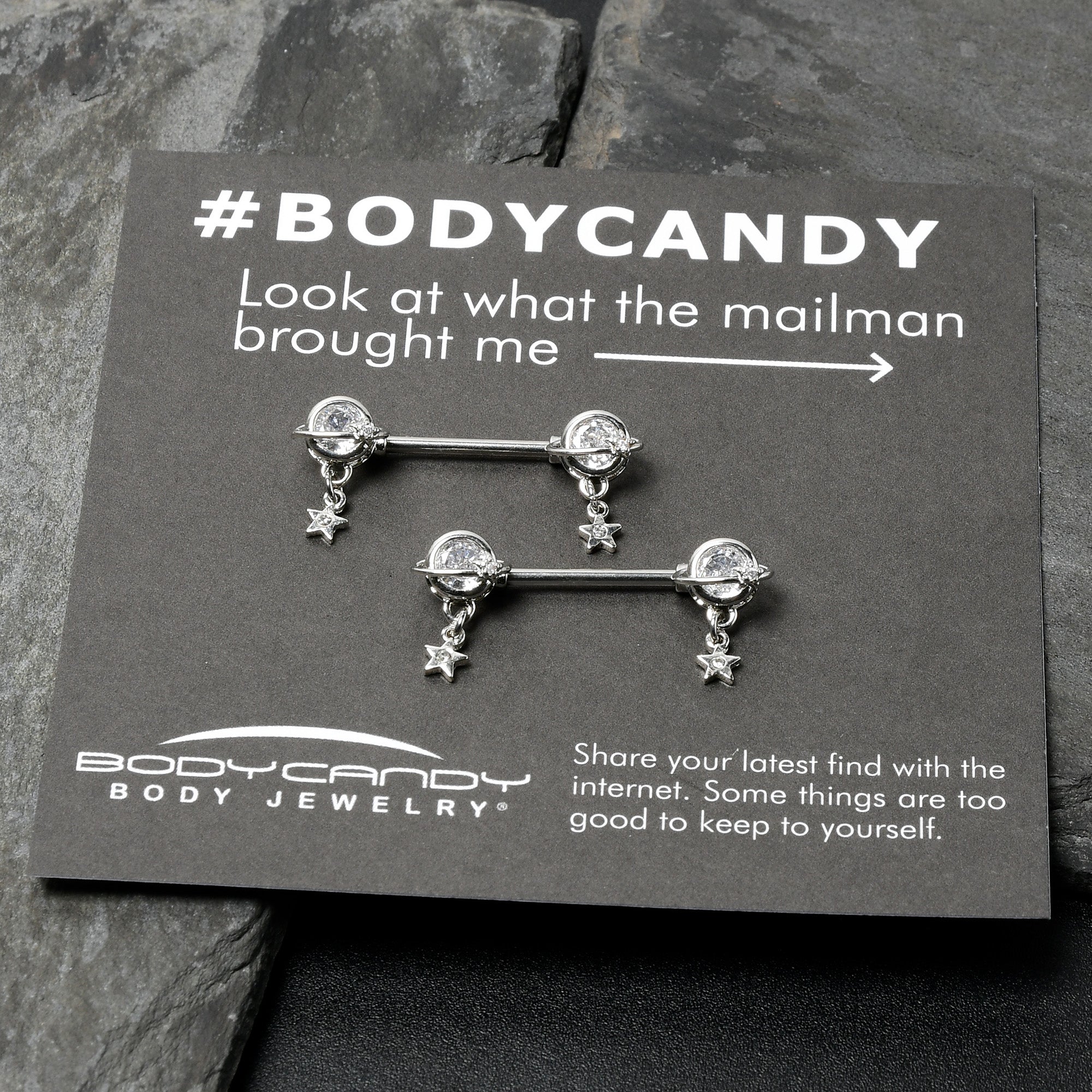 BodyCandy 14G 9/16 Clear CZ Gem Starry Saturn Dangle Nipple Ring Set — in-use photo