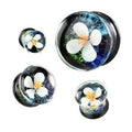 BodyCandy Double Flare Serene Floating Flower Glass Saddle Plug — main product shot