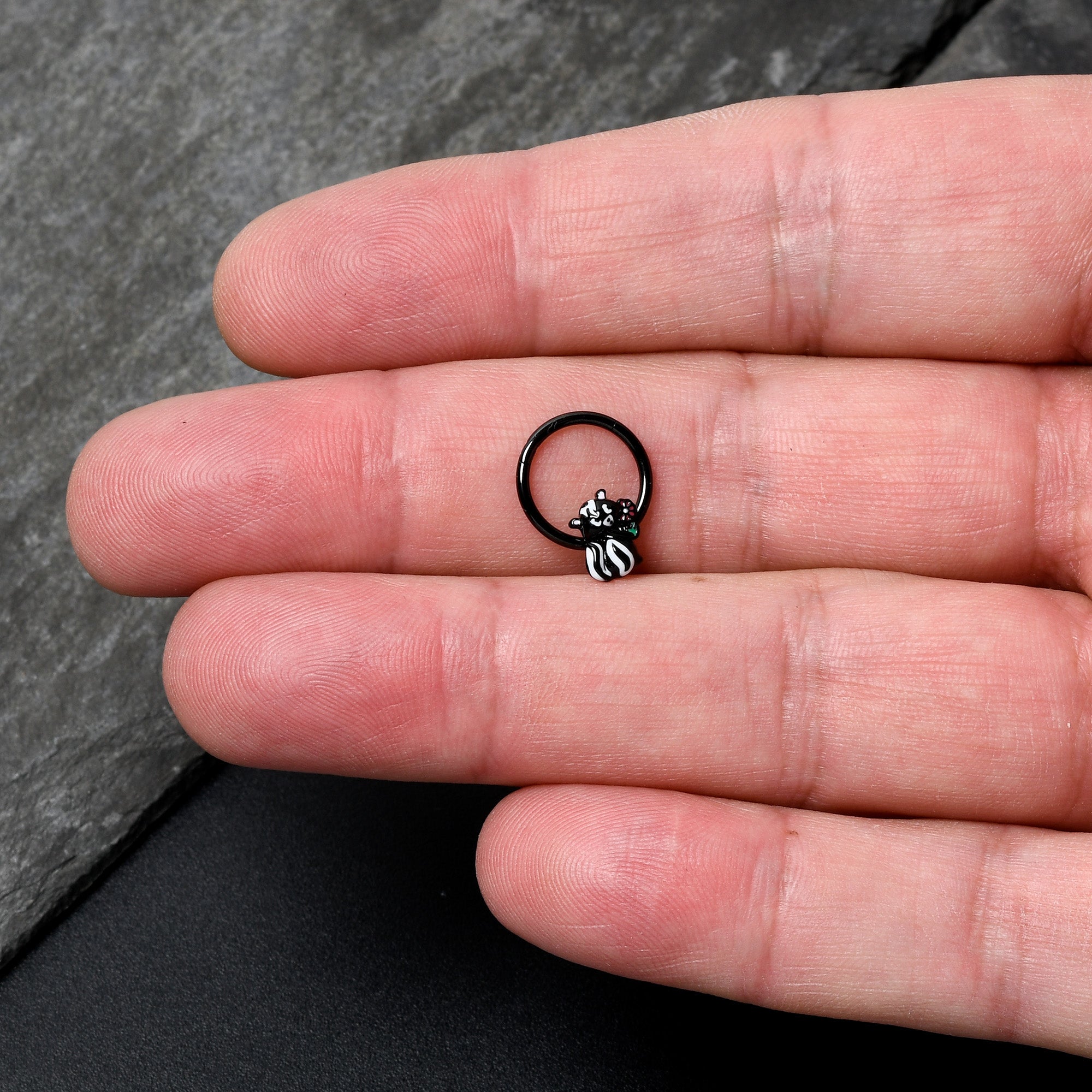 BodyCandy 16G 3/8 Black Funky Skunk Hinged Segment Ring — lifestyle context