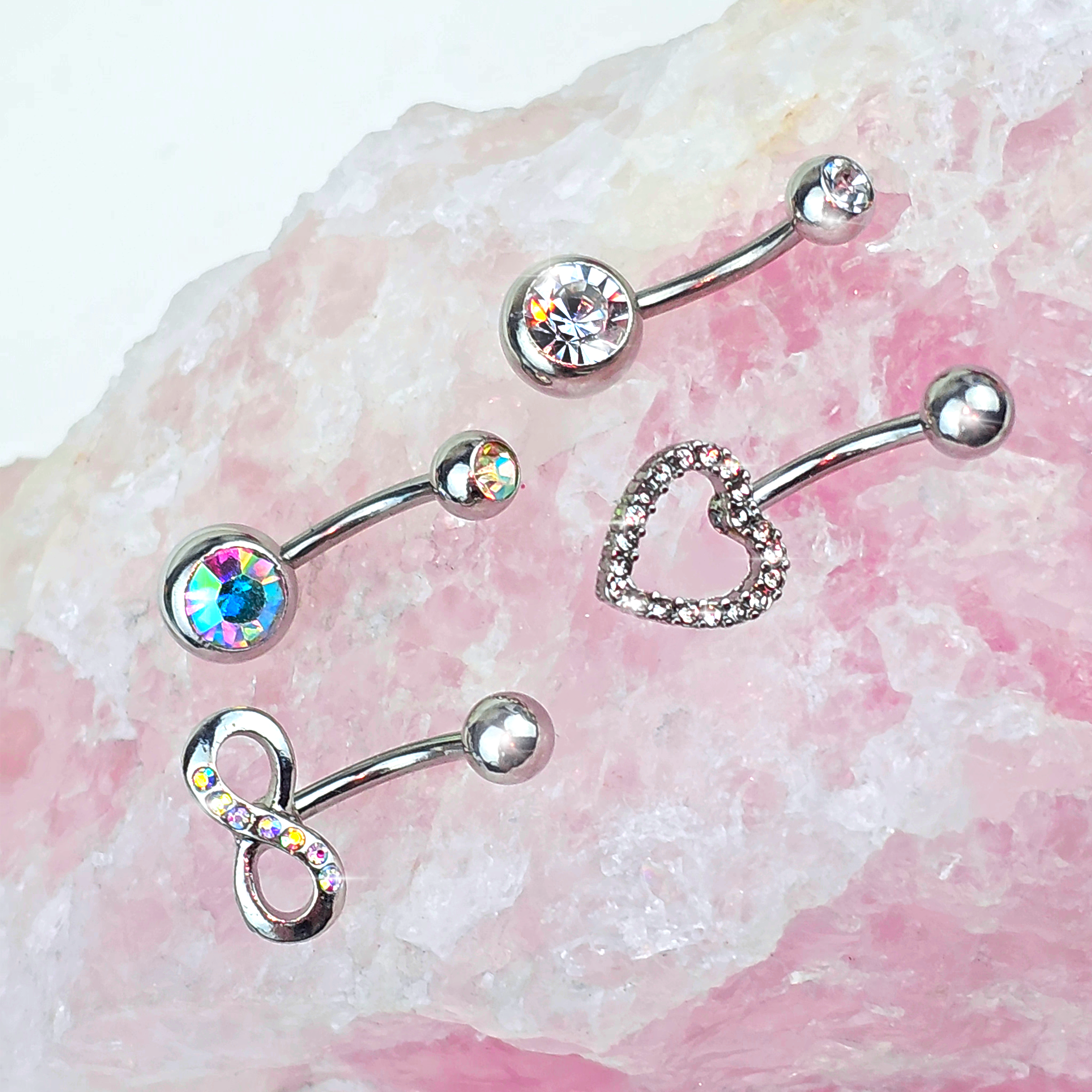 BodyCandy Clear Aurora Gem Heart Infinity Belly Ring Set of 4 — detail close-up