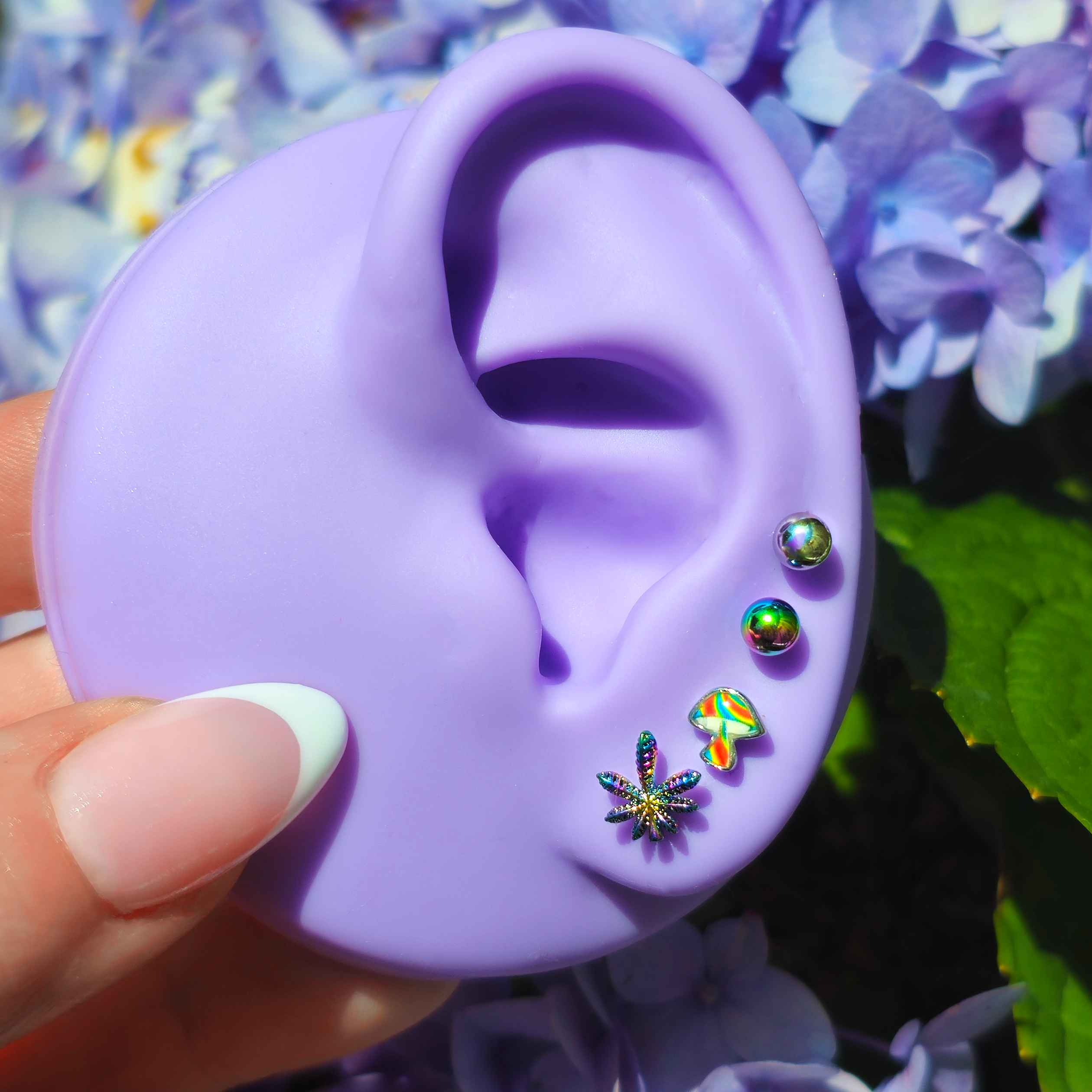 BodyCandy 16G 1/4 Rainbow Pot Leaf Mushroom Cartilage Earring Curation Set of 4 — detail close-up