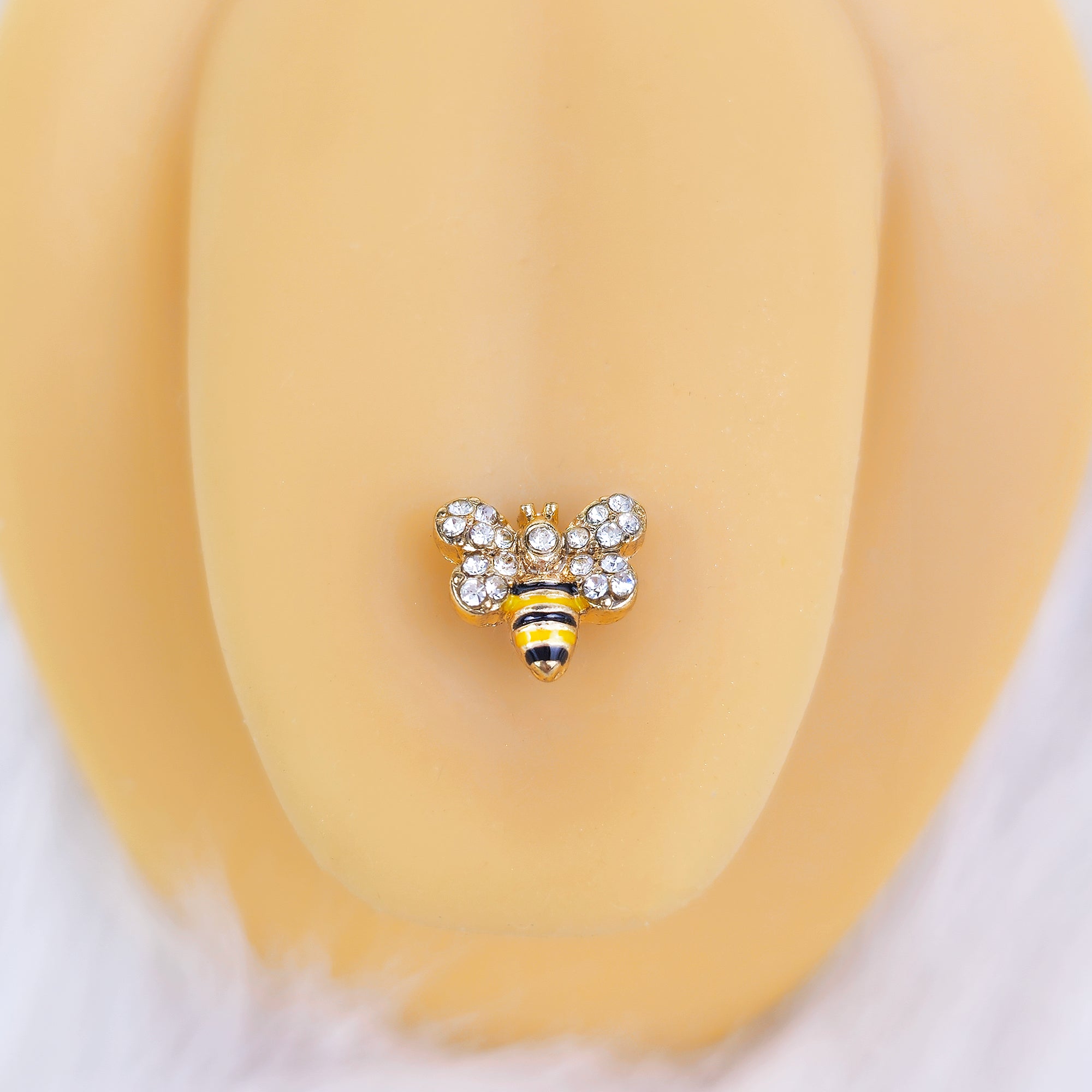 BodyCandy Clear Gem Gold Tone Daisy Bee Barbell Tongue Ring Set of 4 — lifestyle context