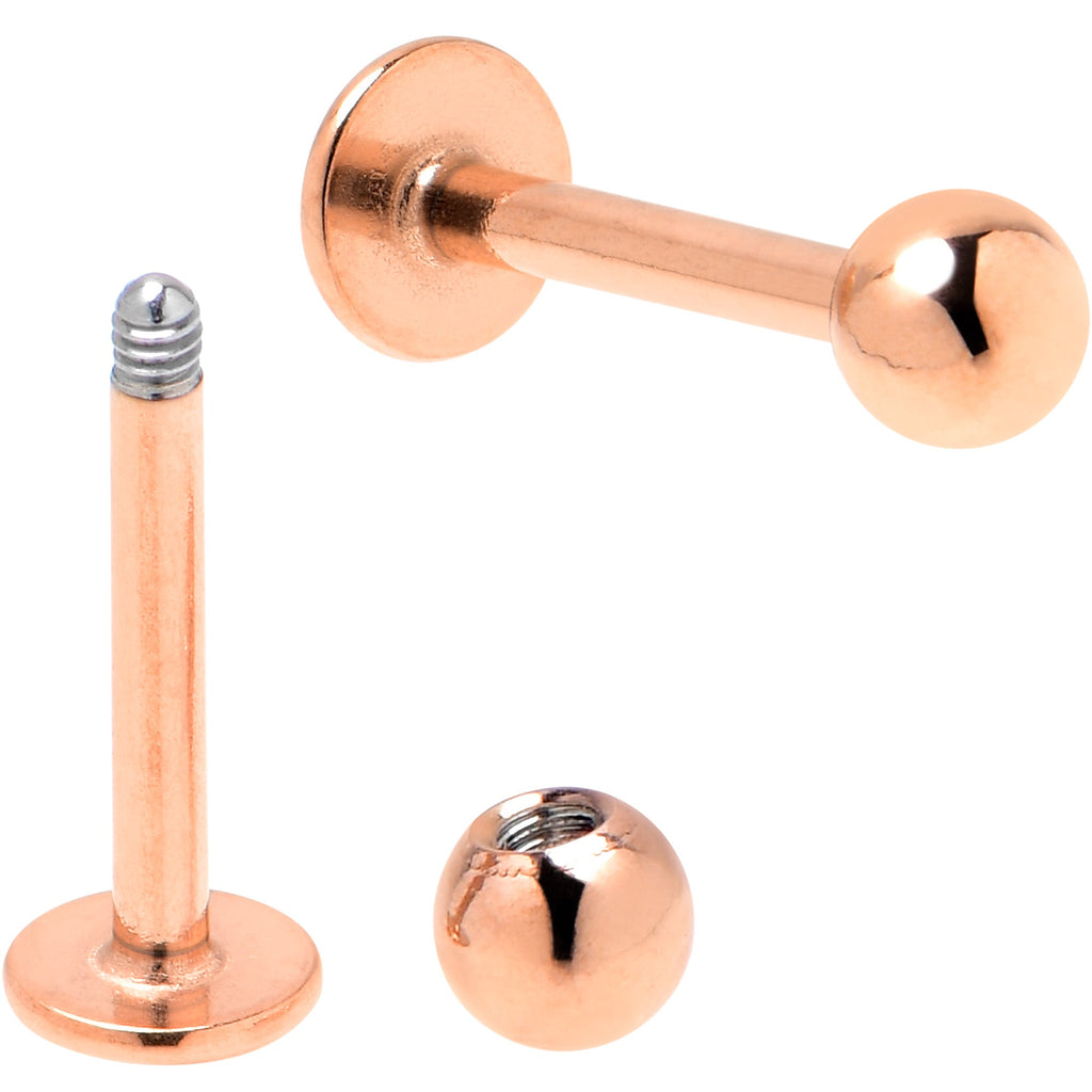 BodyCandy 16G 5/16 Rose Gold Tone Smiling Face Broken Heart Labret Set of 4 — detail close-up