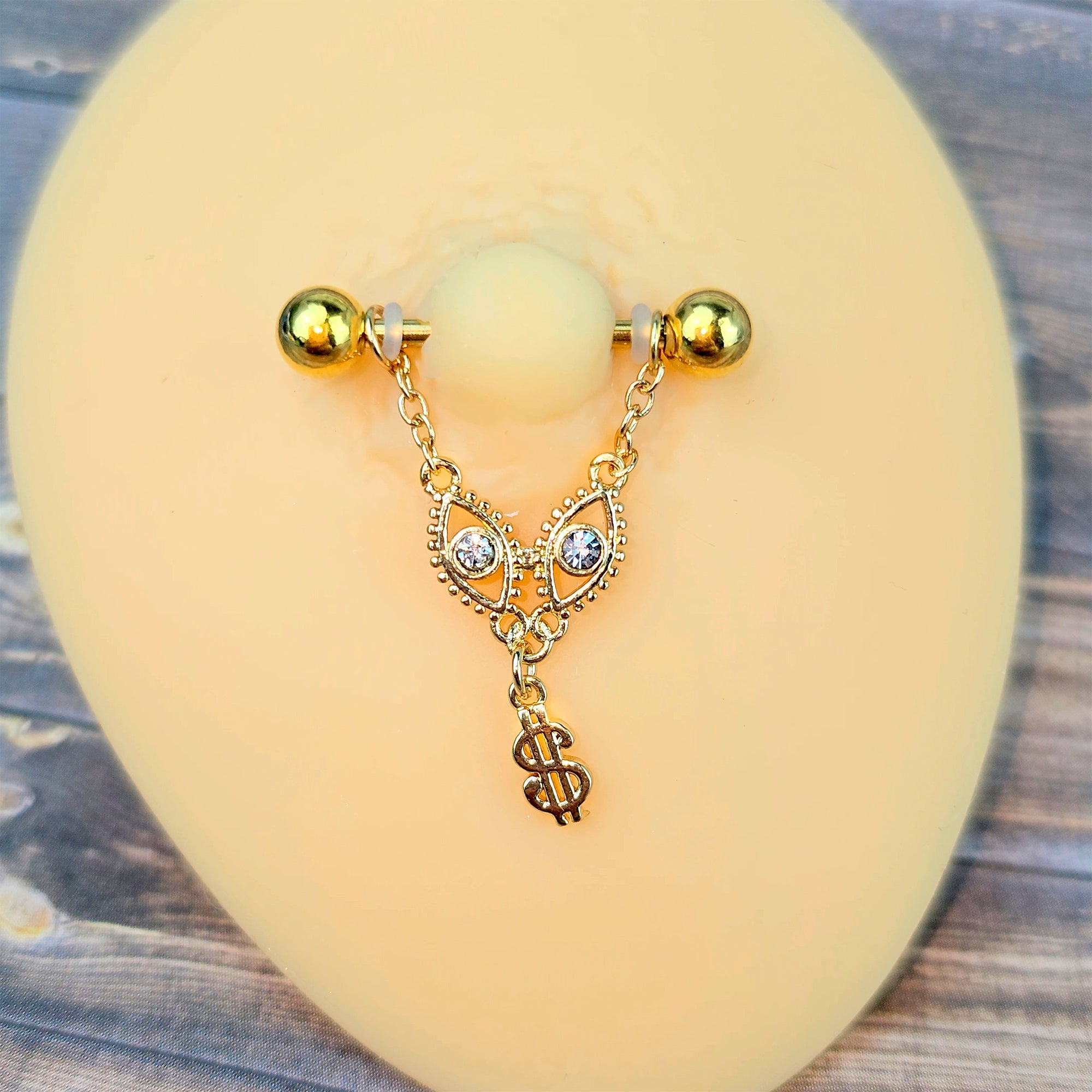 BodyCandy 14G 9/16 Gold Tone Dollar Sign Chain Dangle Nipple Ring Set — main product shot