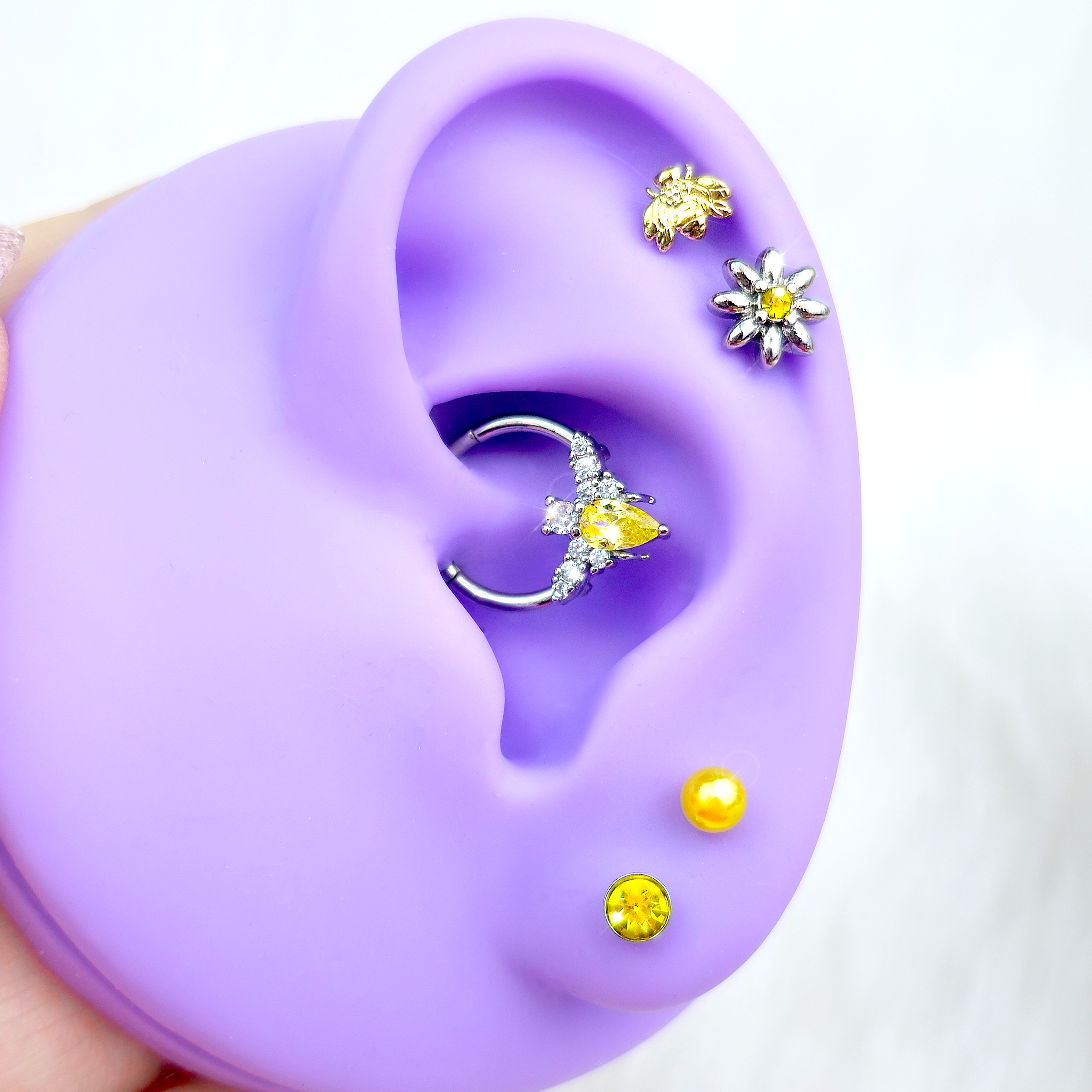 BodyCandy 16G Yellow Gem Bee Flower Labret Segment Ring Ear Curation Set of 5 — detail close-up
