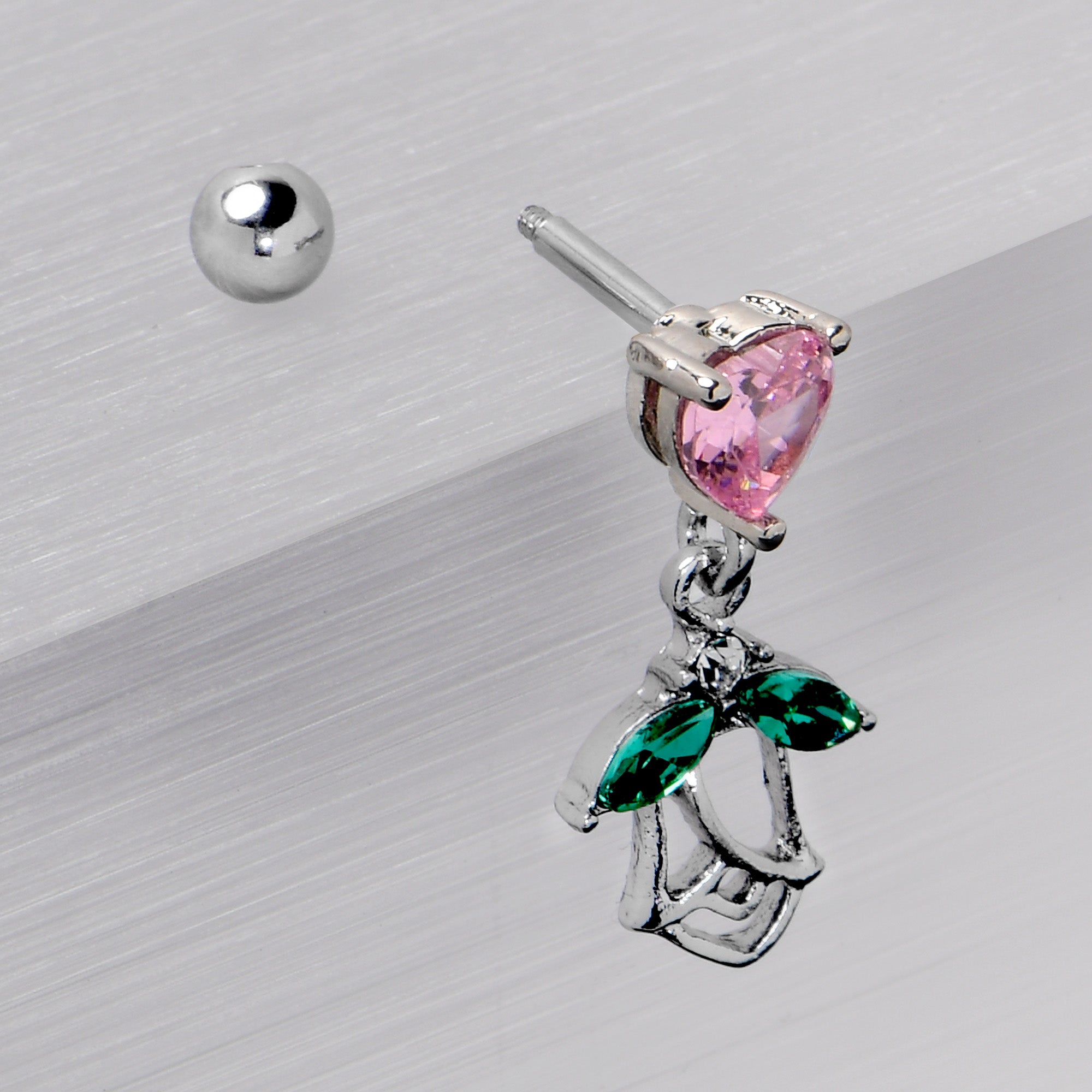 BodyCandy 16G 1/4 Pink CZ Gem Heart And Rose Dangle Cartilage Earring — in-use photo