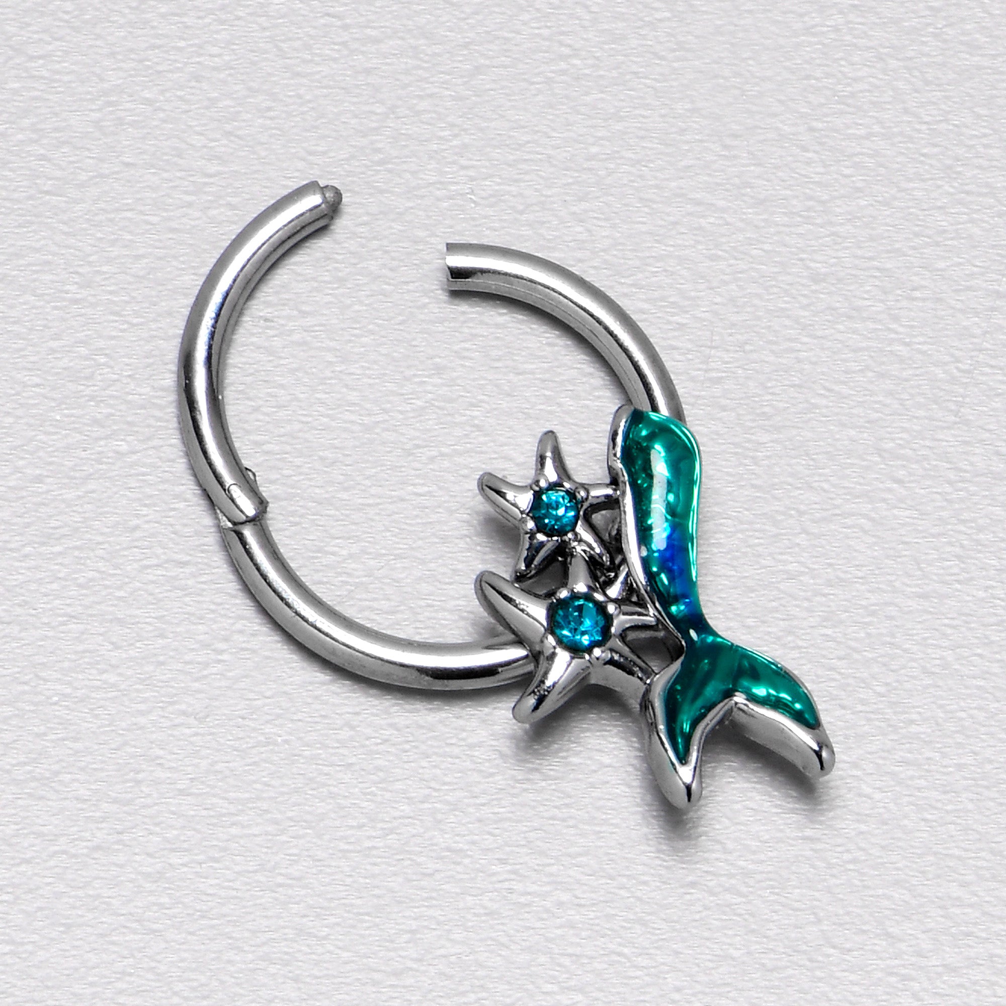 BodyCandy 16G 3/8 Blue Gem Green Mermaid Tail Stars Hinged Segment Ring — in-use photo