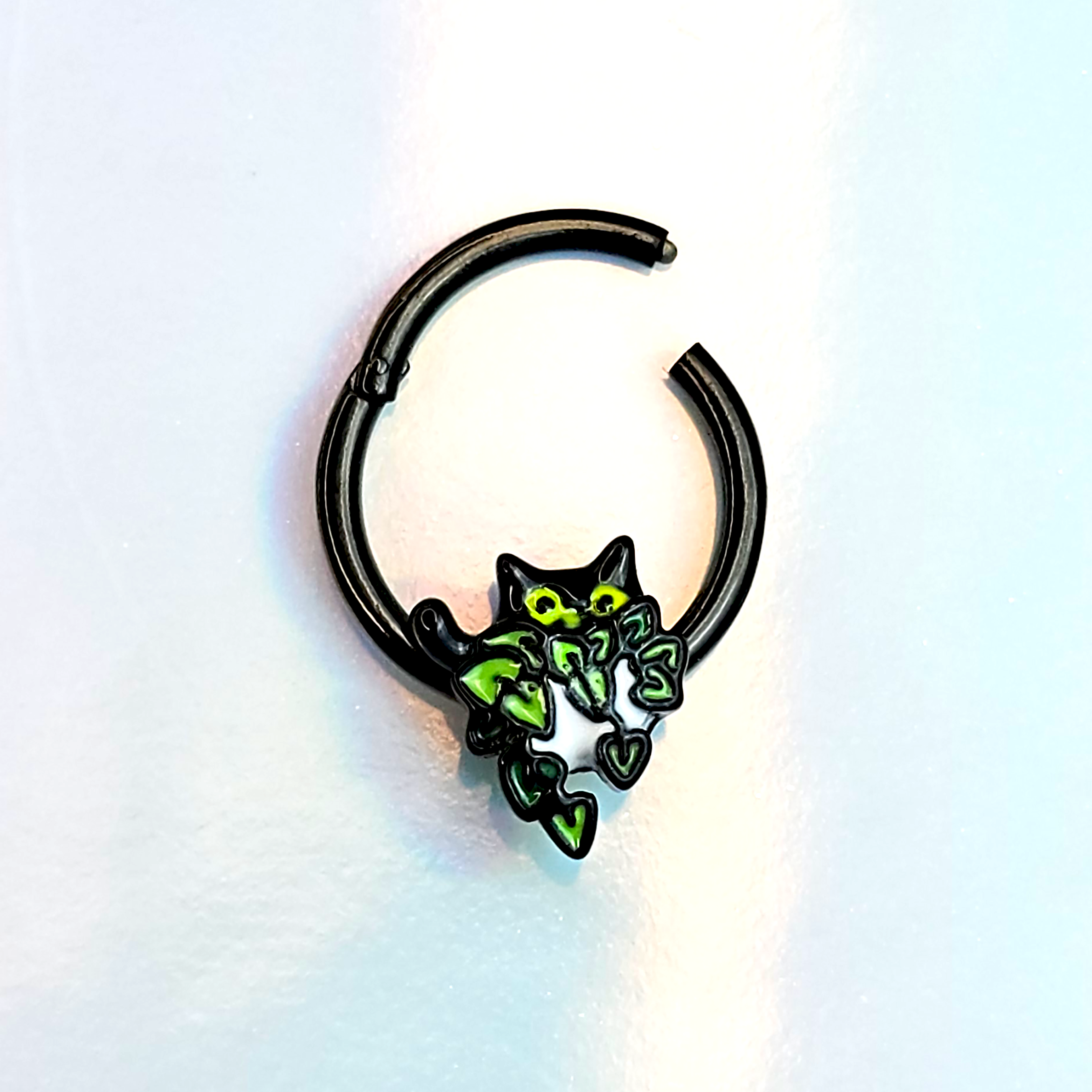 BodyCandy 20G 5/16 Black Pouncing Cat Nose Hoop — detail close-up