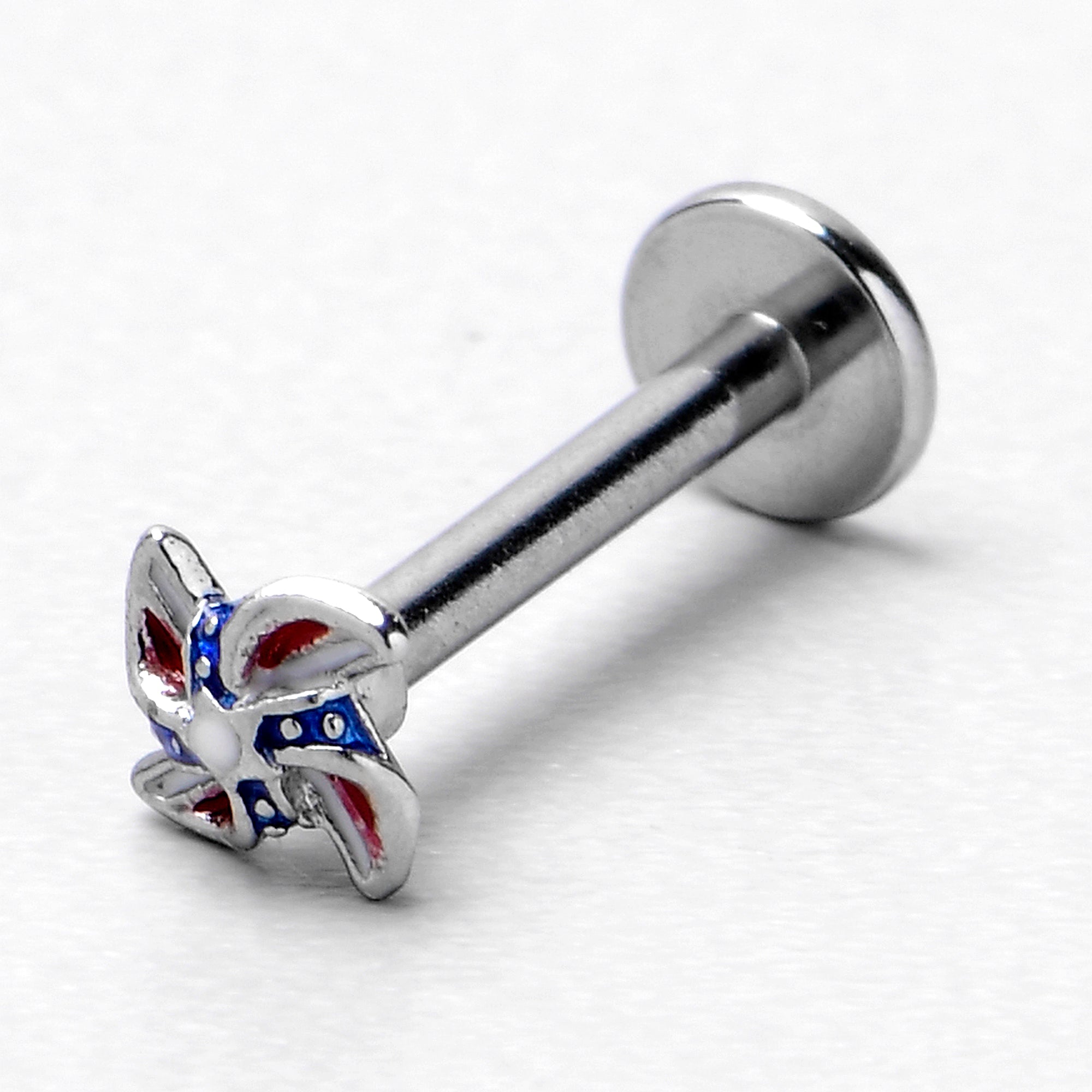 BodyCandy 16G 5/16 Patriotic Pinwheel Labret Monroe Tragus — in-use photo