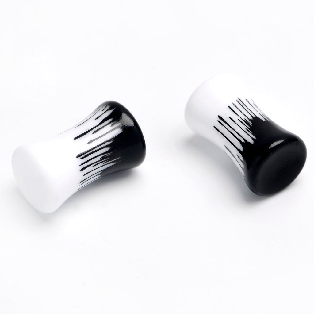 BodyCandy White Black Drip Acrylic Double Flare Plugs — detail close-up
