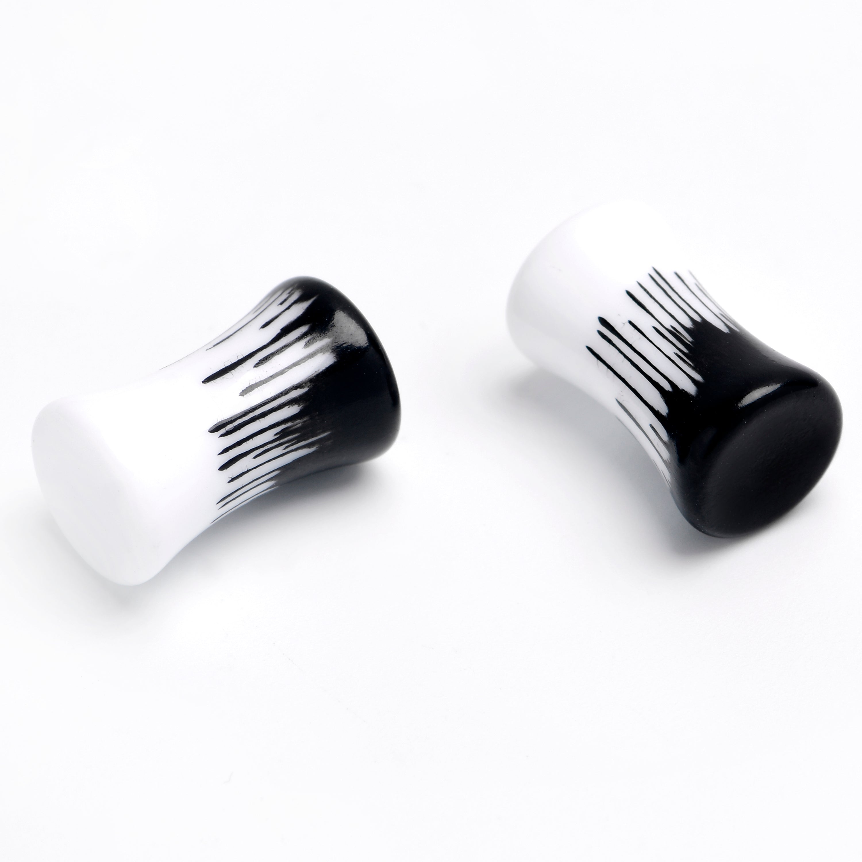 BodyCandy White Black Drip Acrylic Double Flare Plugs — detail close-up