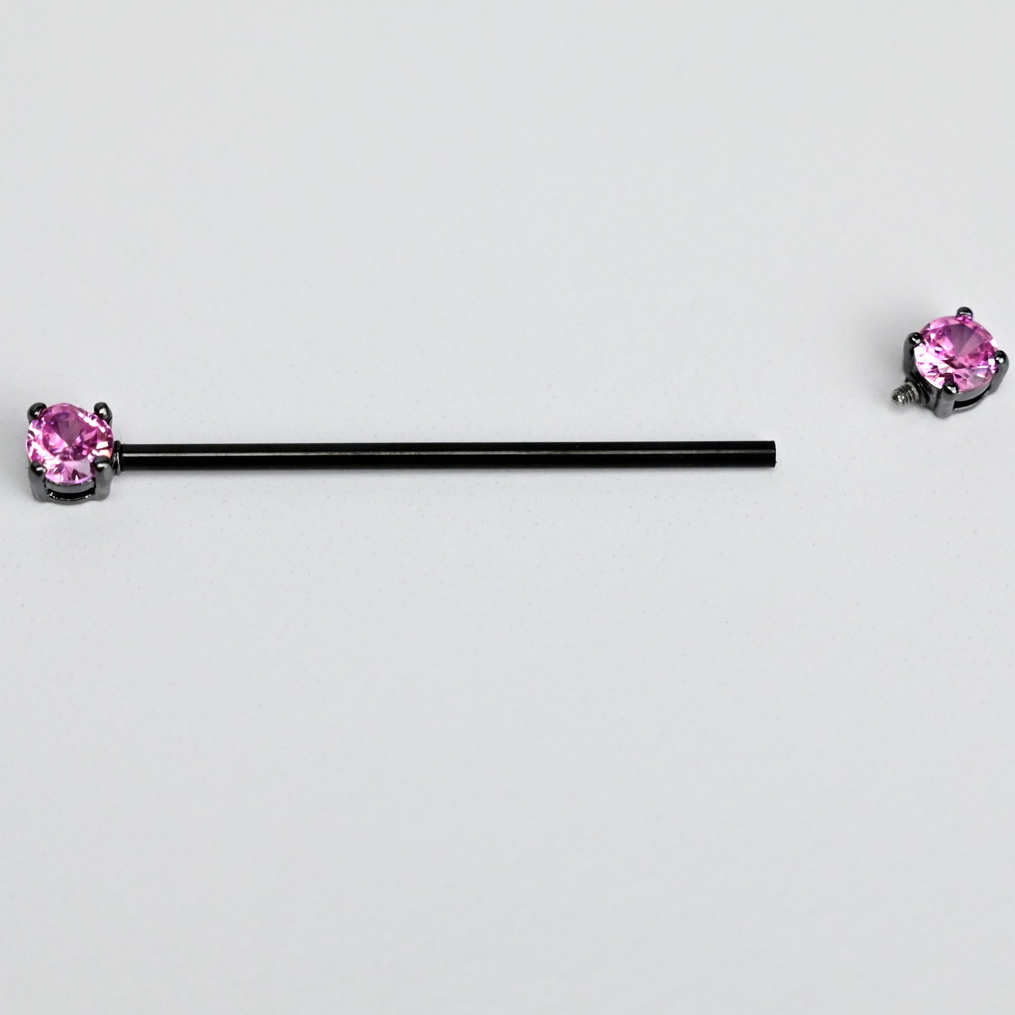 BodyCandy 14G Pink Gem Black Forward Facing Internally Threaded Industrial Barbell 38mm — lifestyle context