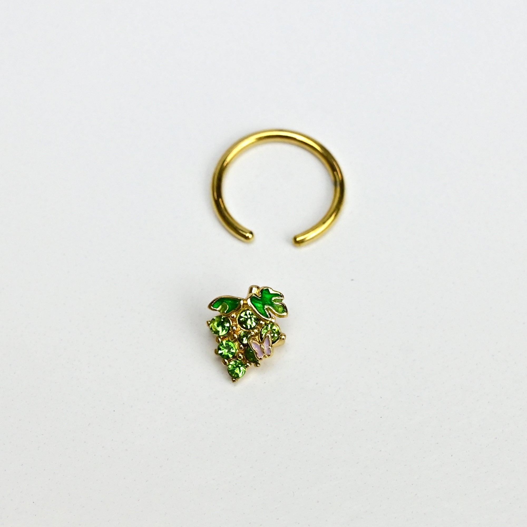 BodyCandy 16G 3/8 Green Gem Gold Tone Butterfly Grapes BCR Captive Ring — lifestyle context