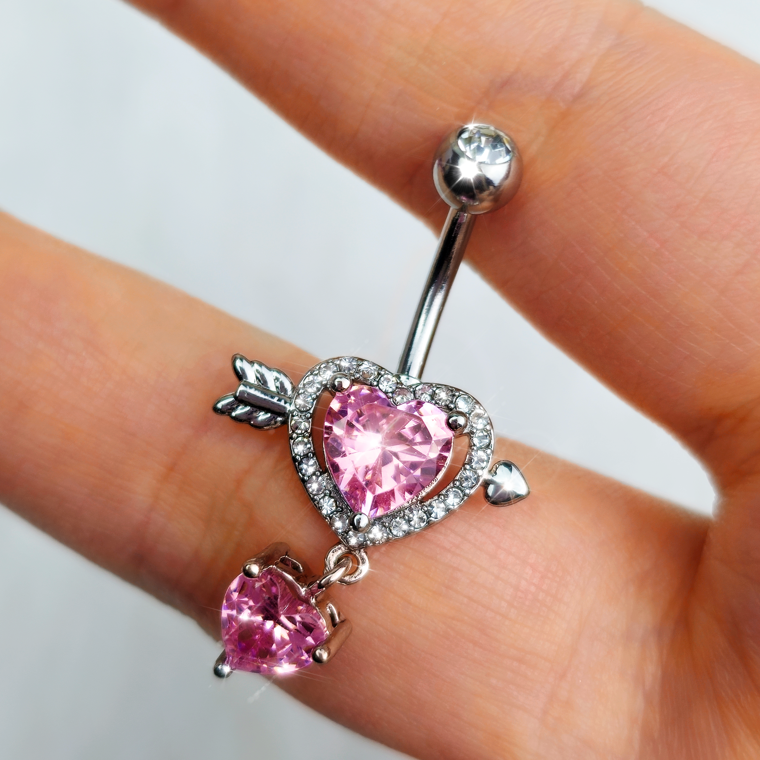 BodyCandy Pink Clear Gem Fusion of Love Heart Arrow Dangle Belly Ring — detail close-up