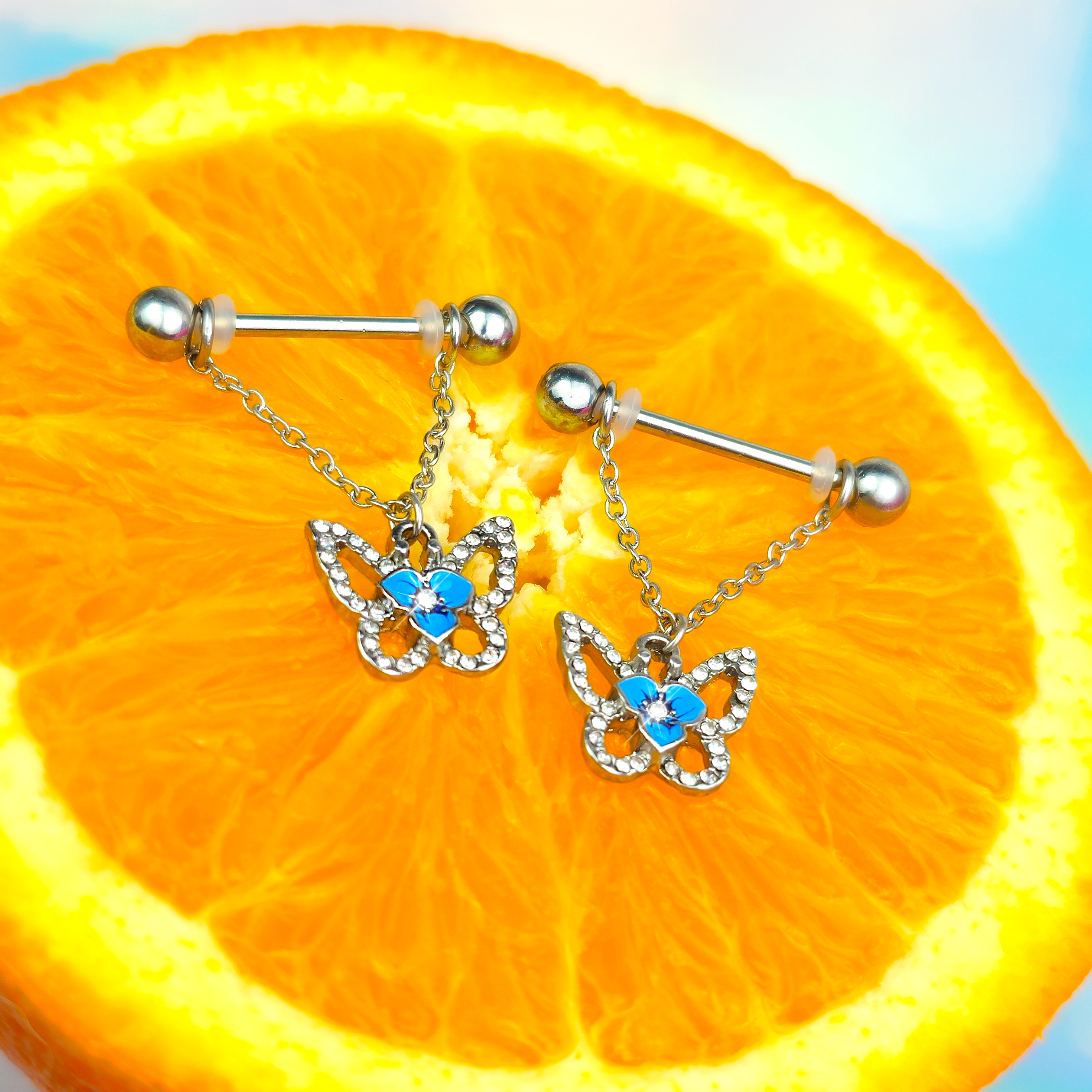 BodyCandy 14G 9/16 Clear Gem Fabulous Butterfly Blue Dangle Nipple Ring Set — detail close-up