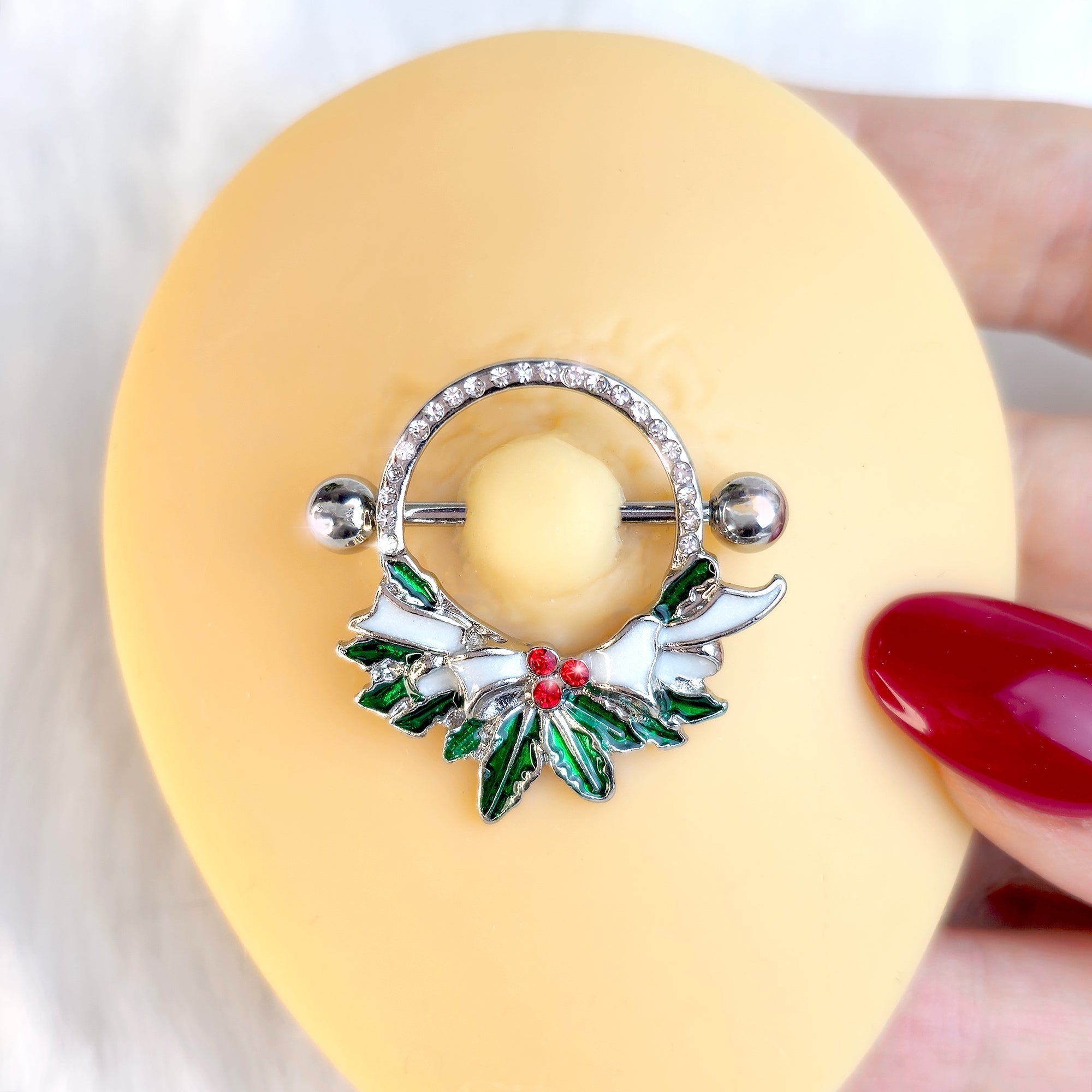 BodyCandy 14G 9/16 Clear Red Gem Lavish Holly Holiday Nipple Shield Set — detail close-up