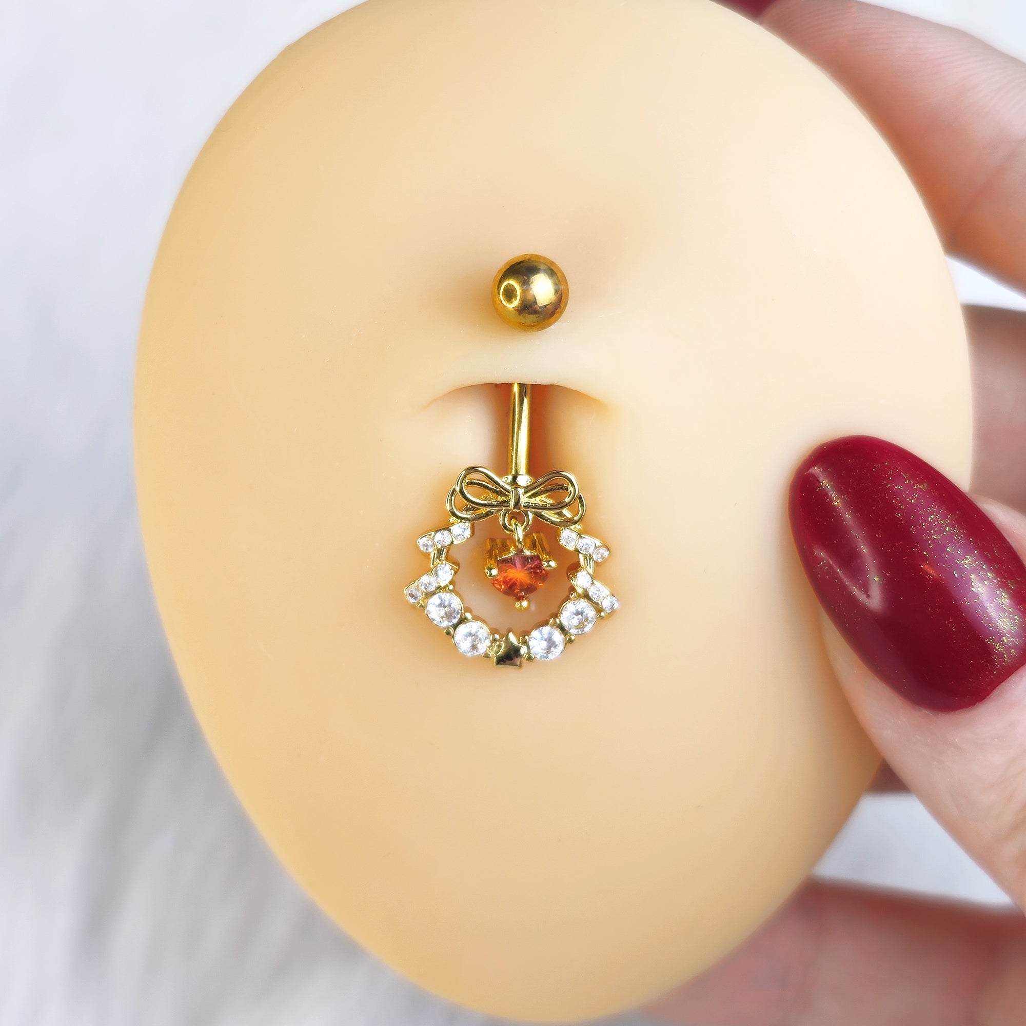BodyCandy Clear Red CZ Gem Gold Tone Heart Wreath of Love Belly Ring — detail close-up