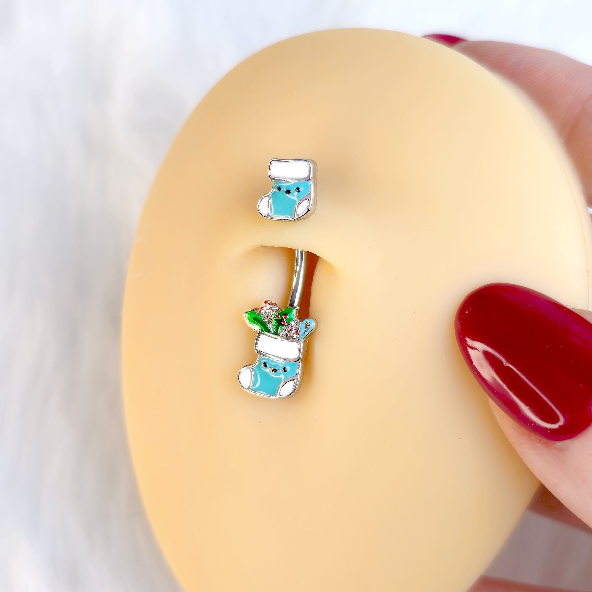 BodyCandy Festive Blue Christmas Stocking Double Mount Belly Ring — detail close-up