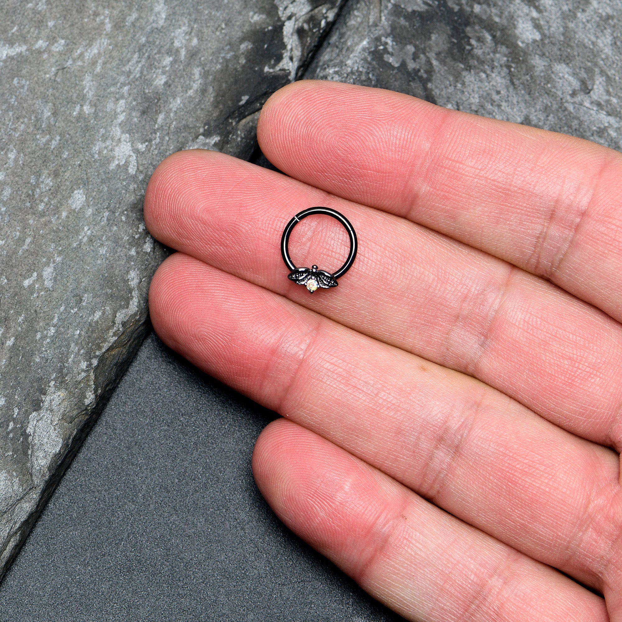 BodyCandy 16G 3/8 Aurora Gem Black Beauty Bug Hinged Segment Ring — lifestyle context