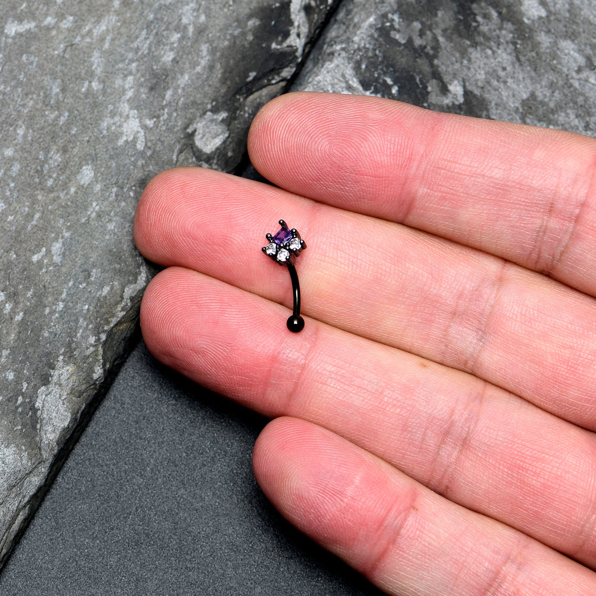 BodyCandy 16G 5/15 Clear Purple CZ Gem Black Rhombus Riot Curved Eyebrow Ring — lifestyle context