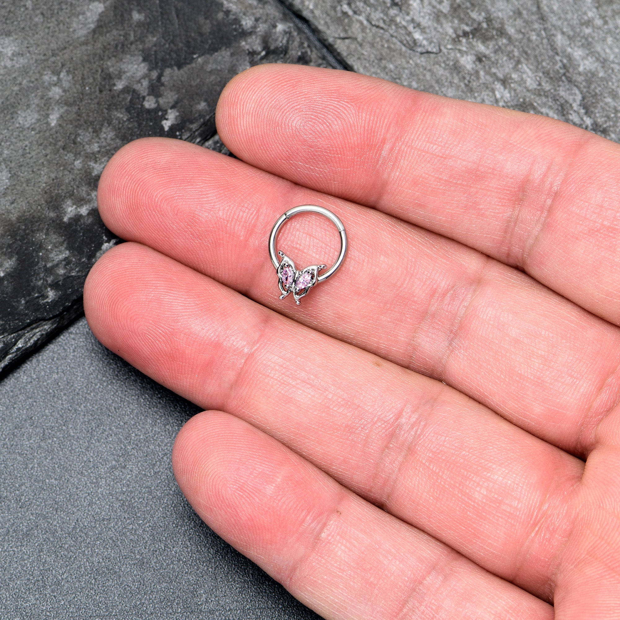 BodyCandy 16G 3/8 Pink Gem Fancy Fab Butterfly Hinged Segment Ring — lifestyle context