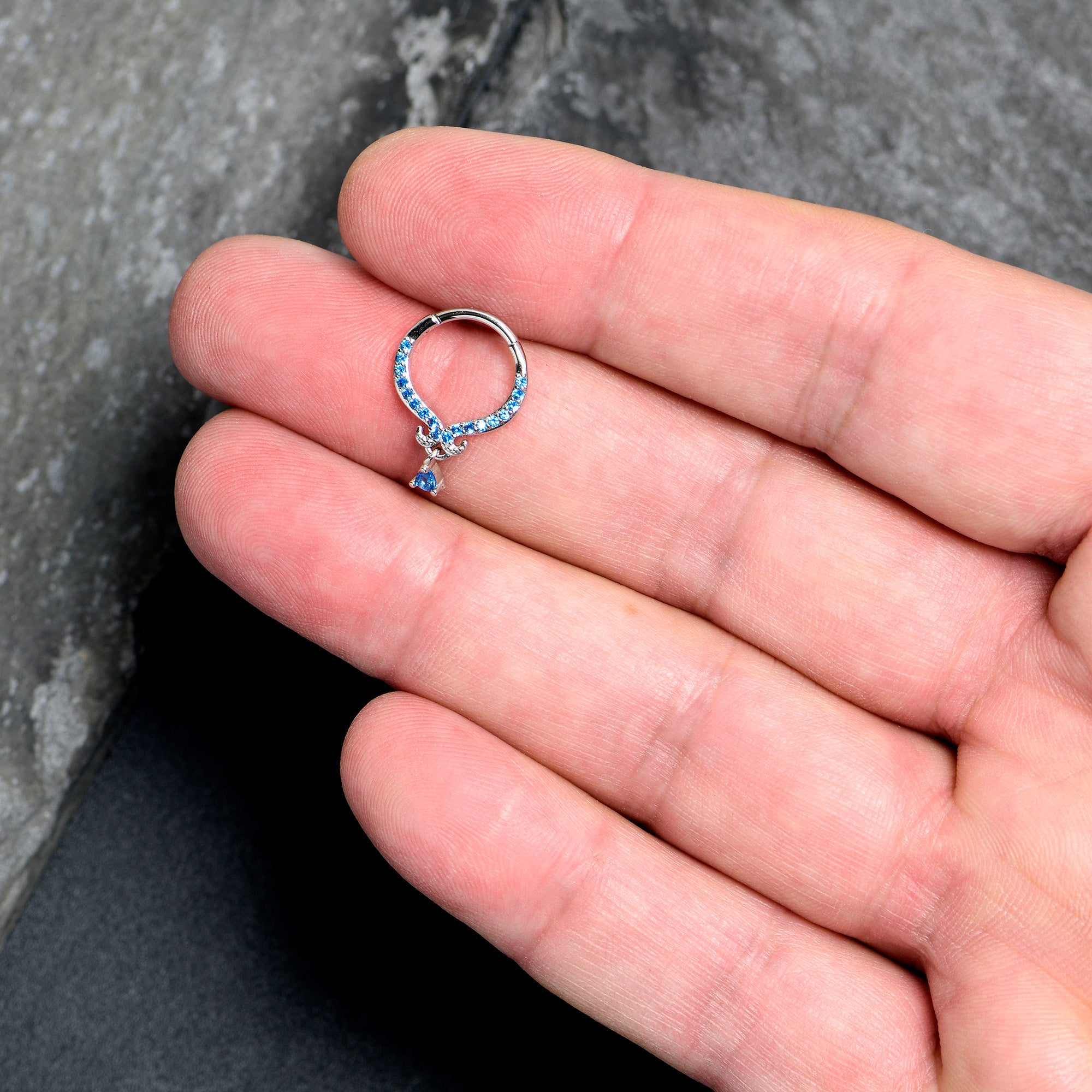 BodyCandy 16G 3/8 Blue CZ Gem Elegant Curves Dangle Hinged Segment Ring — lifestyle context