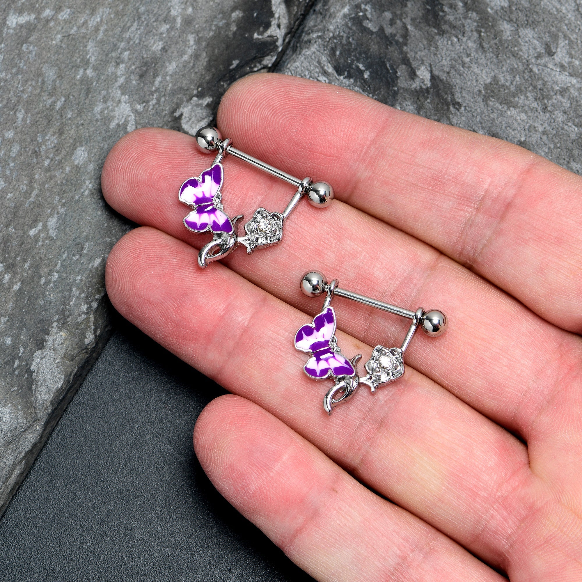 BodyCandy 14G 9/16 Butterfly Purple Rose Flower Dangle Nipple Ring Set — lifestyle context