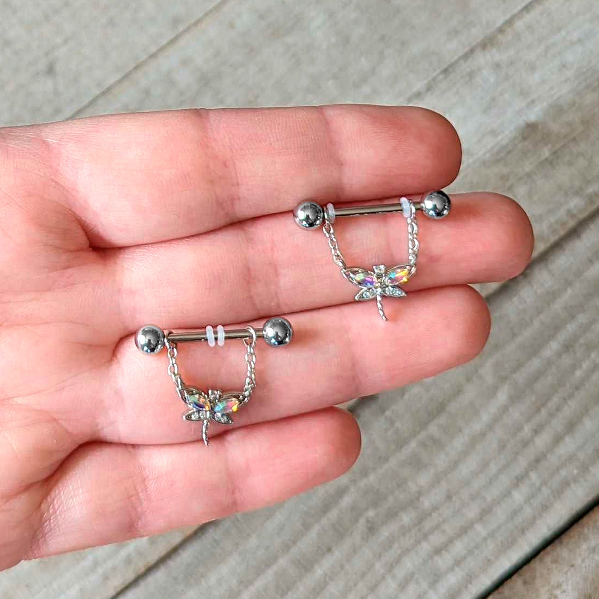 BodyCandy 14G 9/16 Aurora CZ Gem Understated Dragonfly Dangle Nipple Ring Set — detail close-up