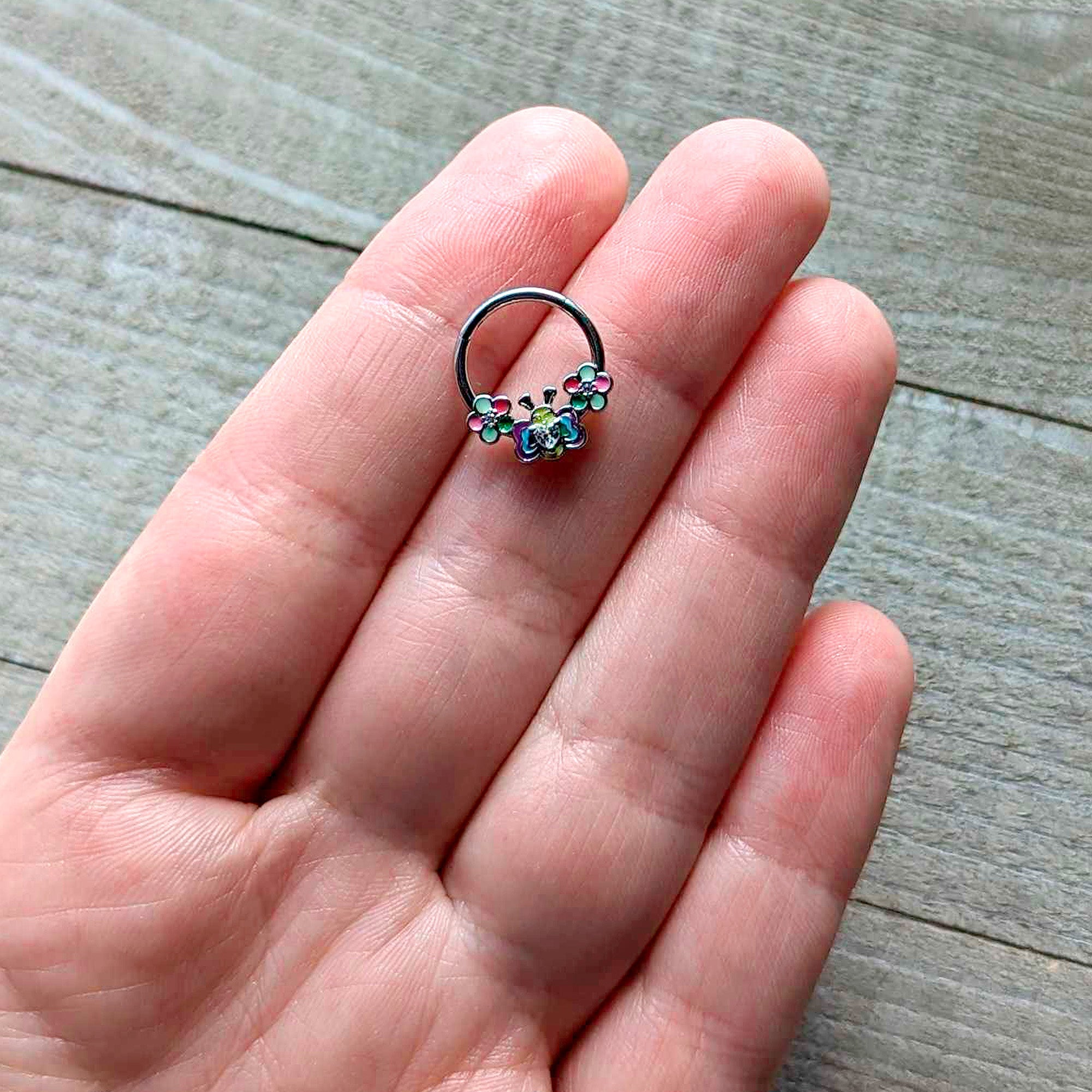 BodyCandy 16G 3/8 Clear CZ Gem Butterfly Love Bug Hinged Segment Ring — detail close-up