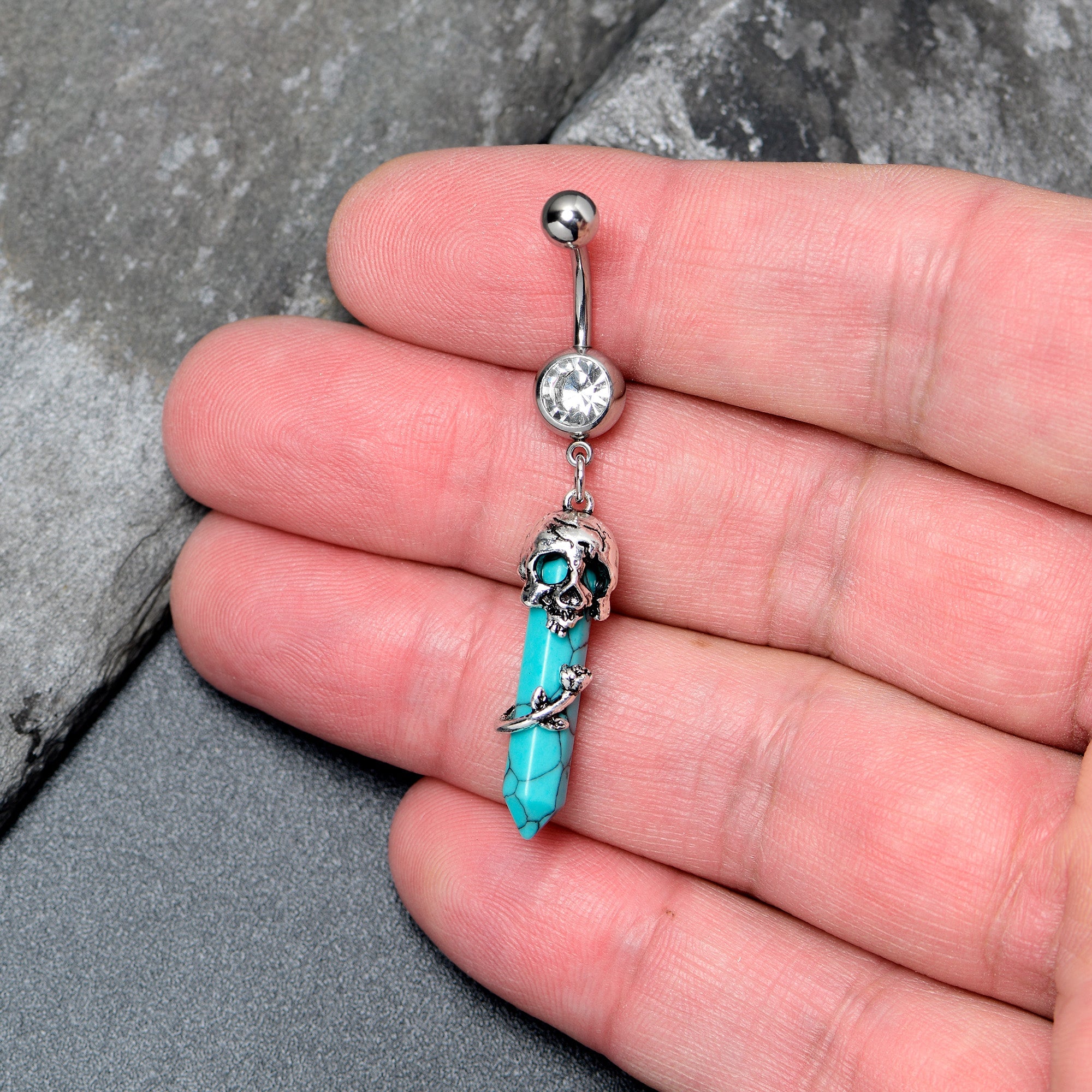 BodyCandy Blue Turquoise Skull Obelisk Rose Dangle Belly Ring — detail close-up