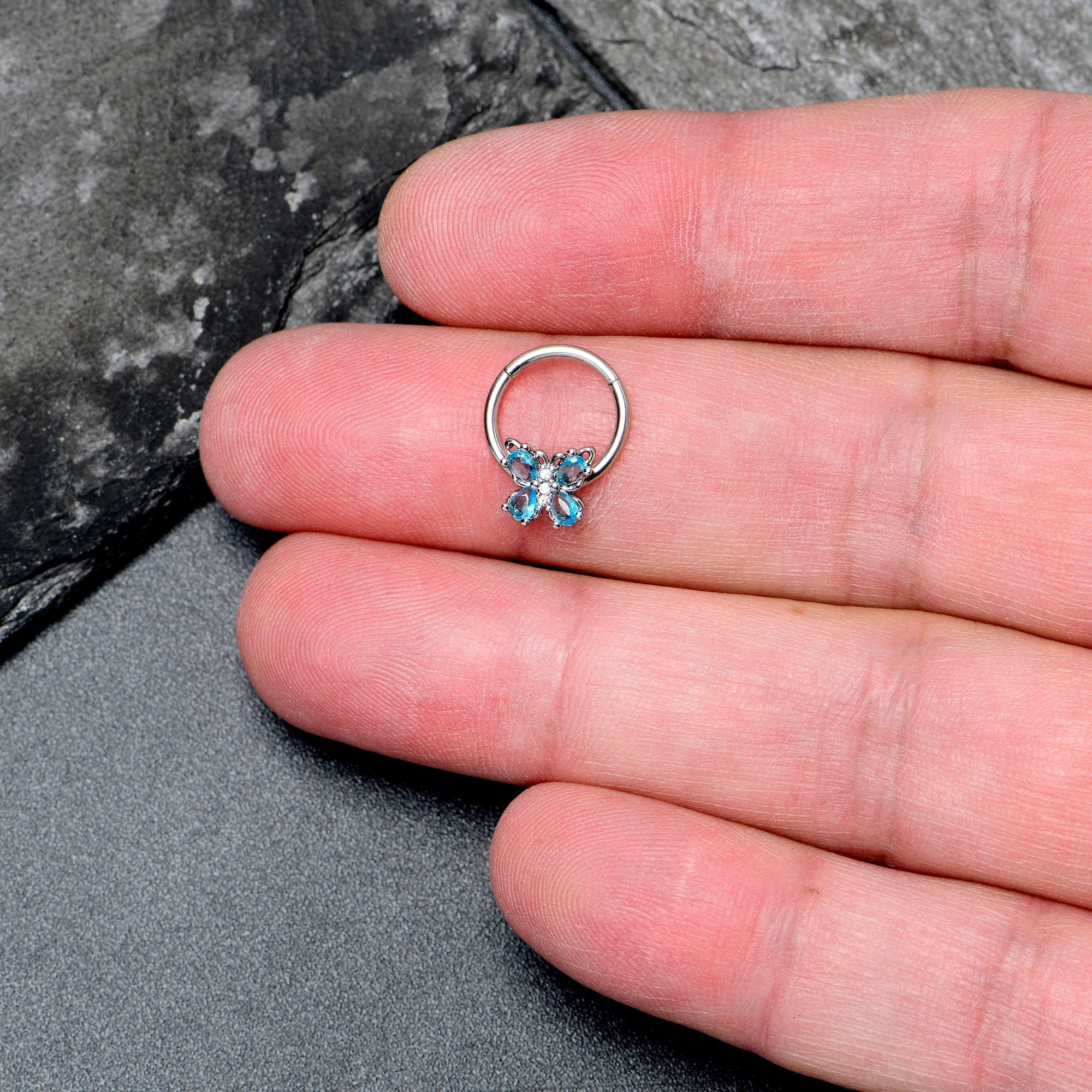 BodyCandy 16G 3/8 Blue Gem Baroque Beauty Butterfly Hinged Segment Ring — lifestyle context