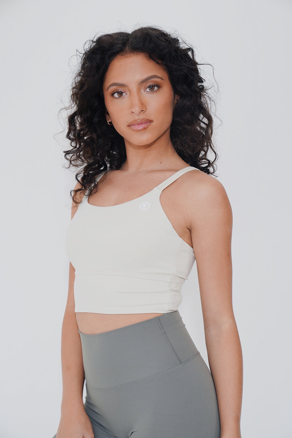 KIMITH BRAND I Am Confident White Cropped Tank — KIMITH BRAND branding close-up