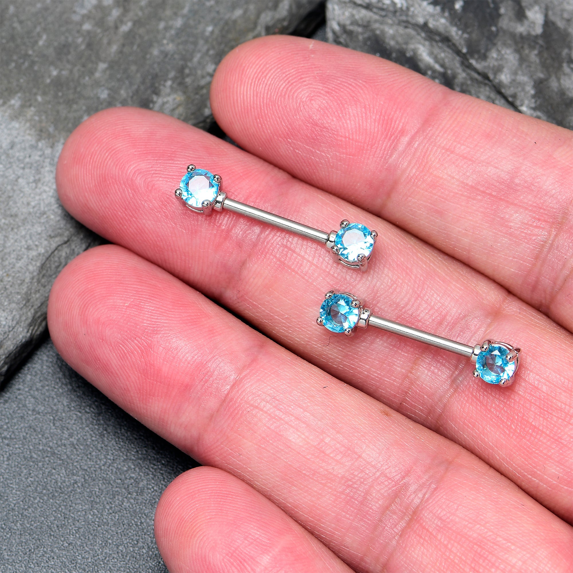 BodyCandy 14G 9/16 Blue CZ Gem Love Forward Facing Barbell Nipple Ring Set — lifestyle context