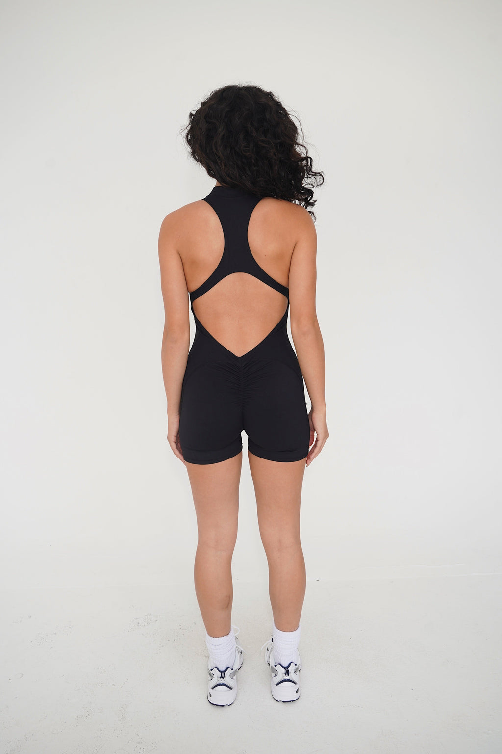 KIMITH BRAND I am Limitless Zipper Bodysuit in Black — detail shot 8