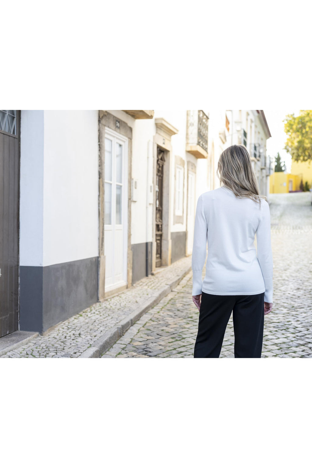 KADOU BOUTIQUE Chevron Knit Turtleneck Sweater — lifestyle context