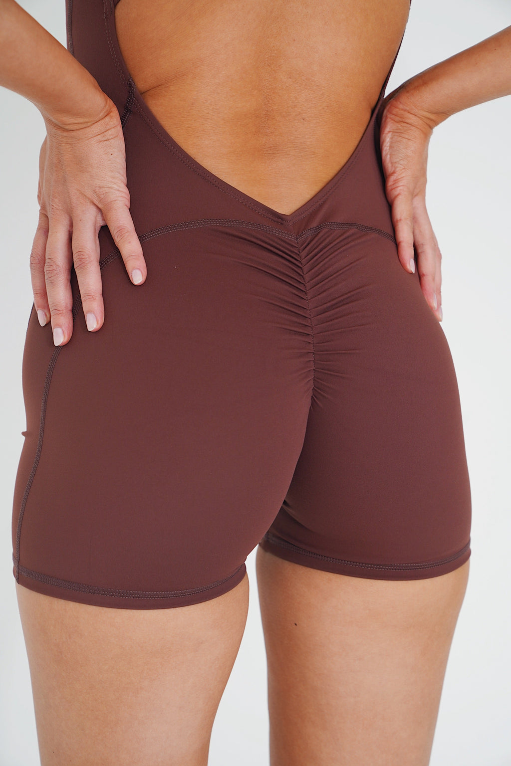 KIMITH BRAND I am Limitless Zipper Bodysuit in Chocolate — detail shot 6