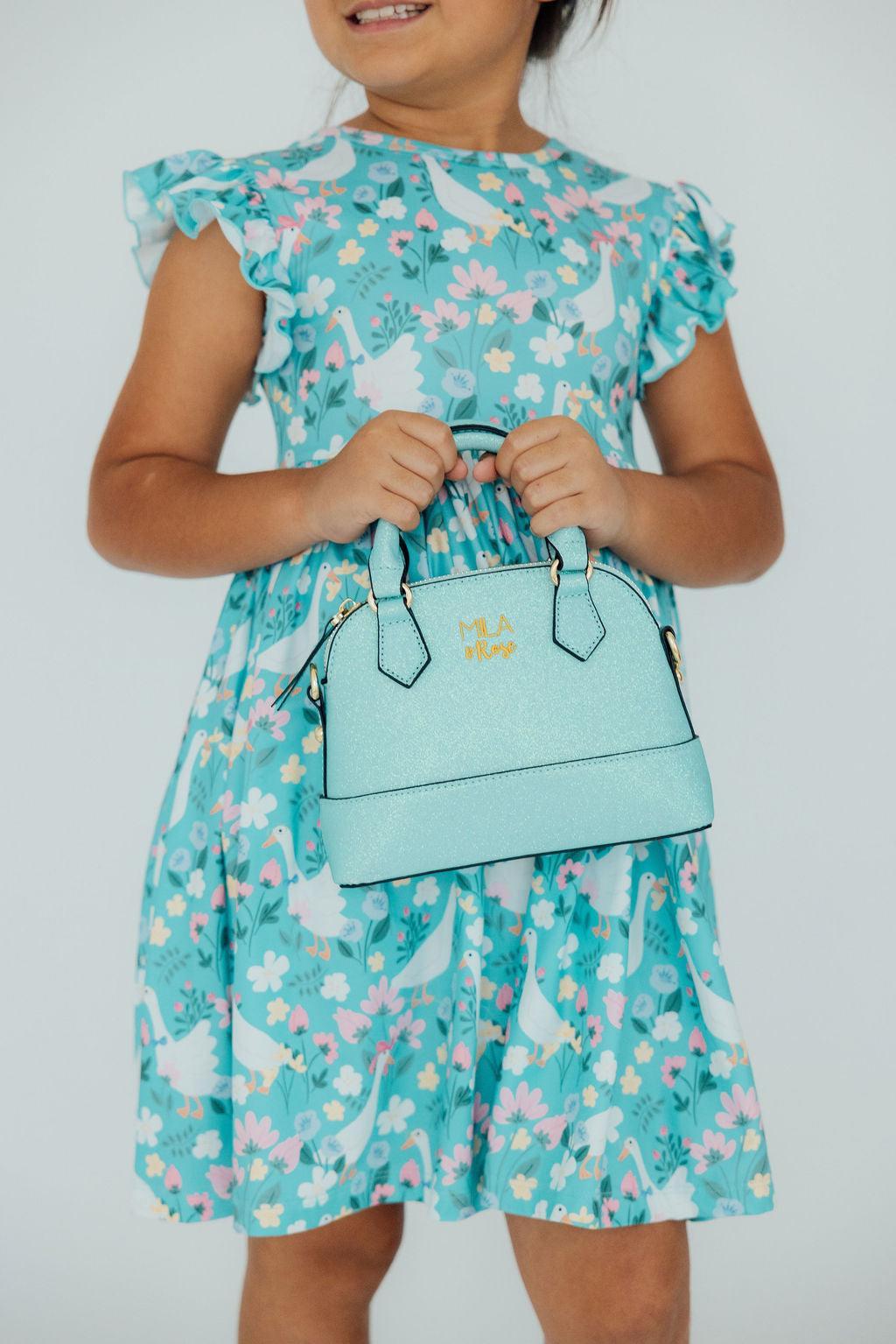 Mila & Rose ® Aqua Glitter Girl's Crossbody Purse — lifestyle context